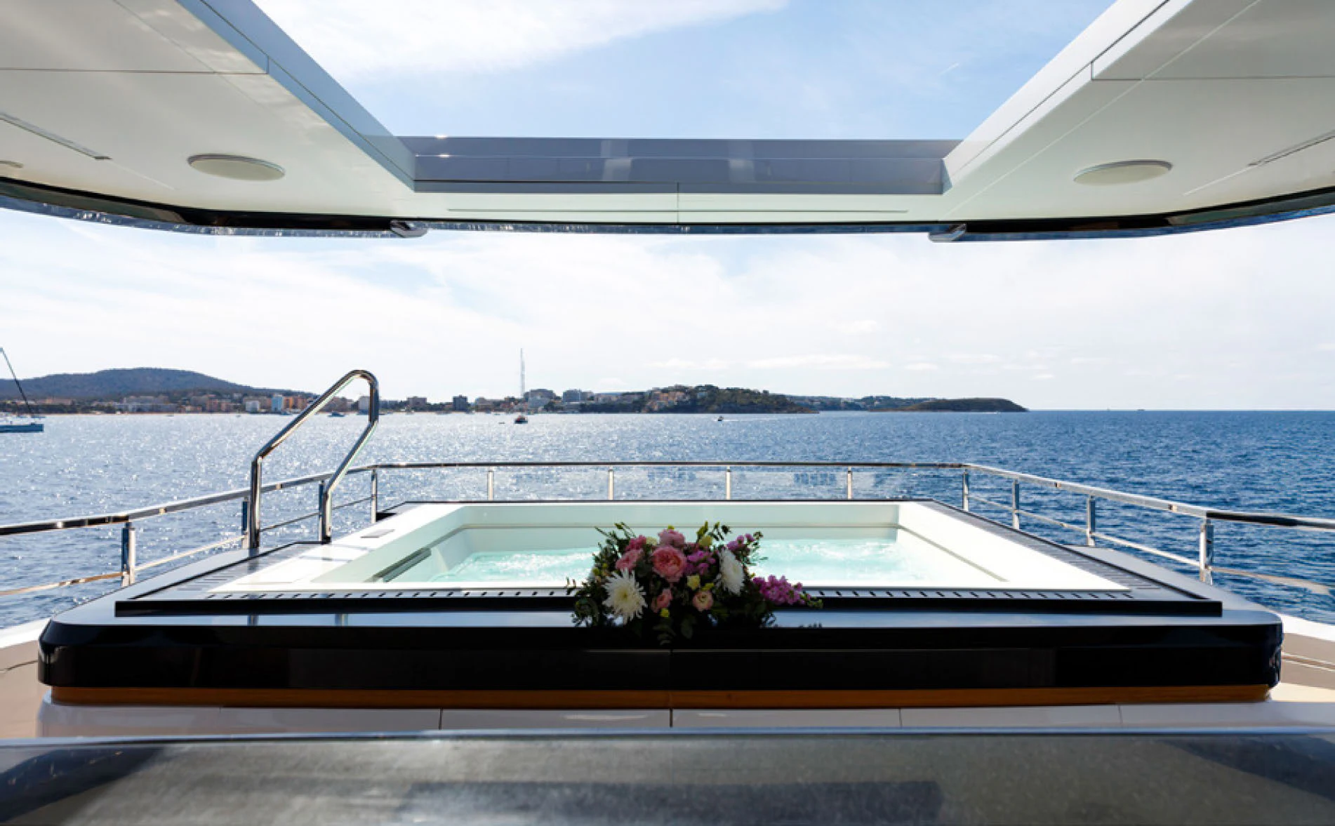 a boat with flowers on the water aboard PERLA BIANCA Yacht for Charter