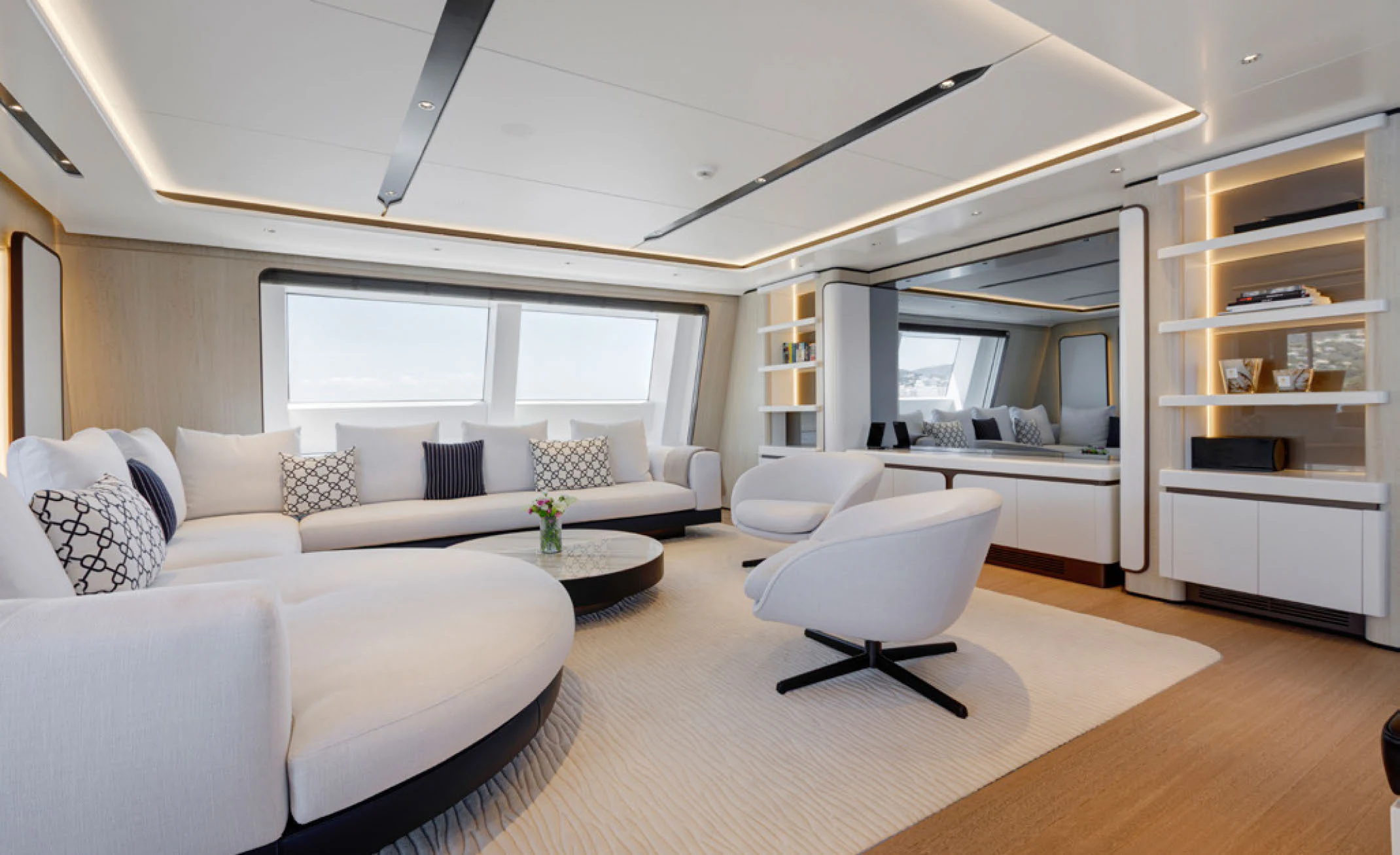 a living room with white furniture aboard PERLA BIANCA Yacht for Charter