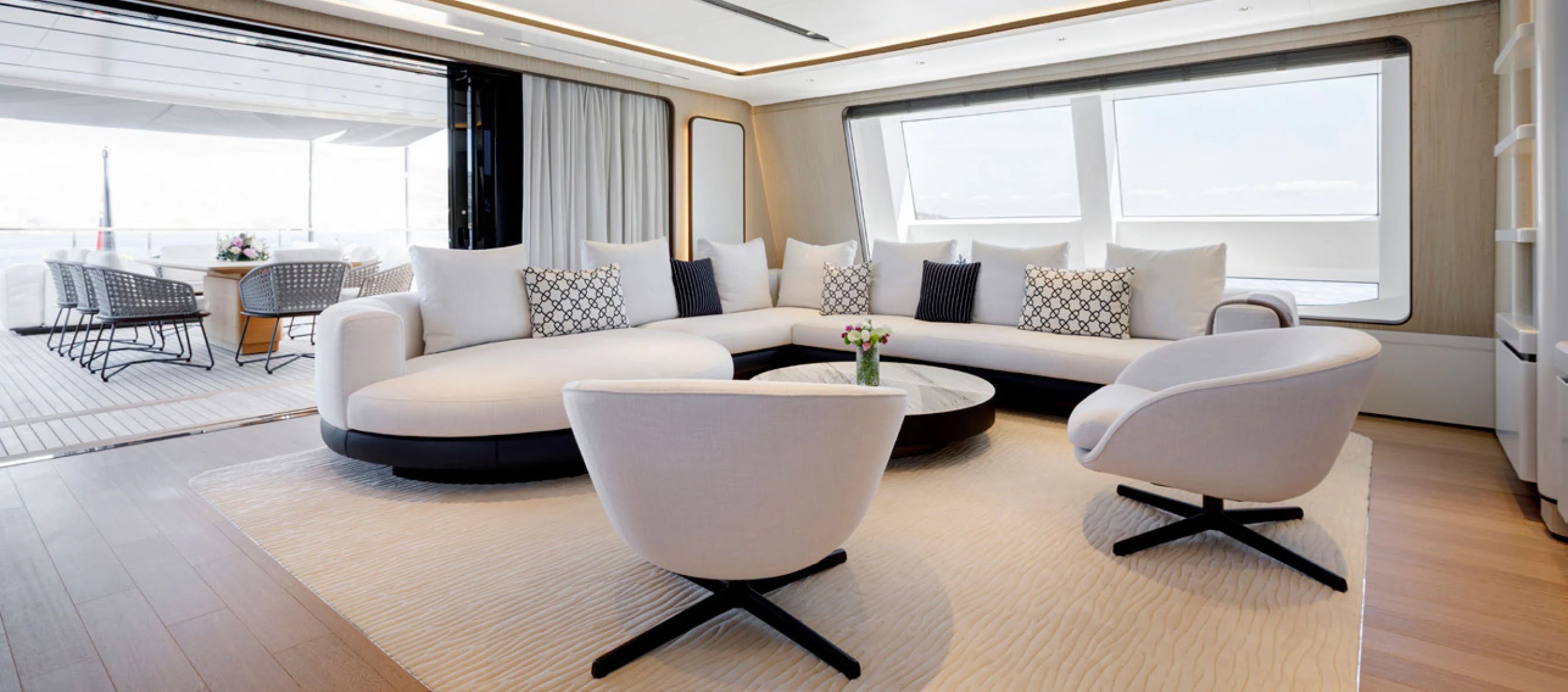a living room with a couch and a table aboard PERLA BIANCA Yacht for Charter