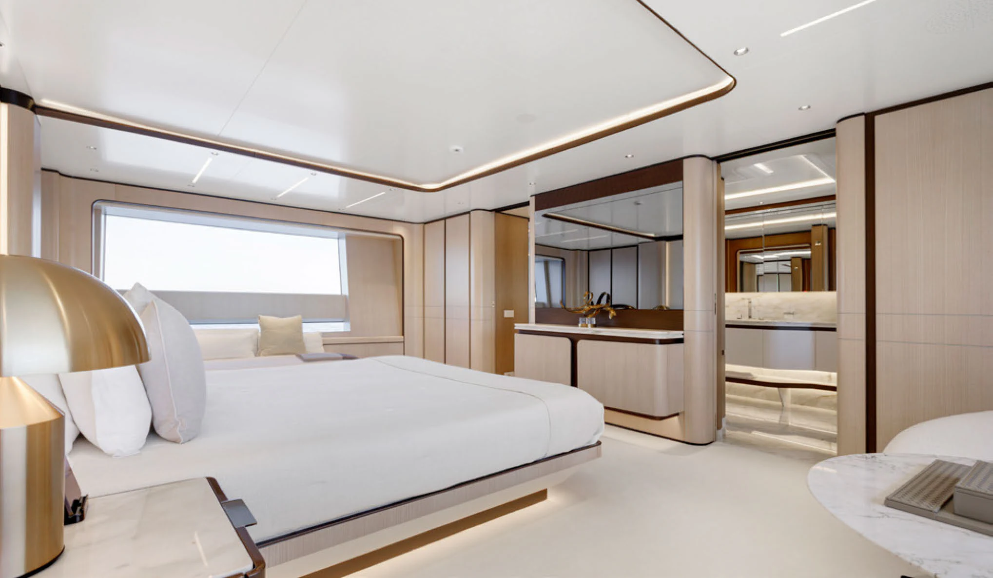 a room with a bed and a desk aboard PERLA BIANCA Yacht for Charter