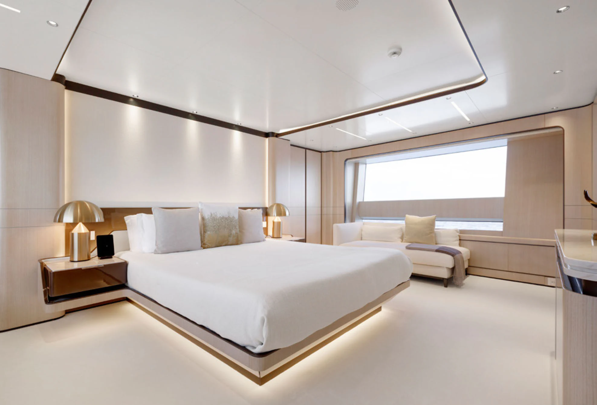 a large white bed in a room aboard PERLA BIANCA Yacht for Charter