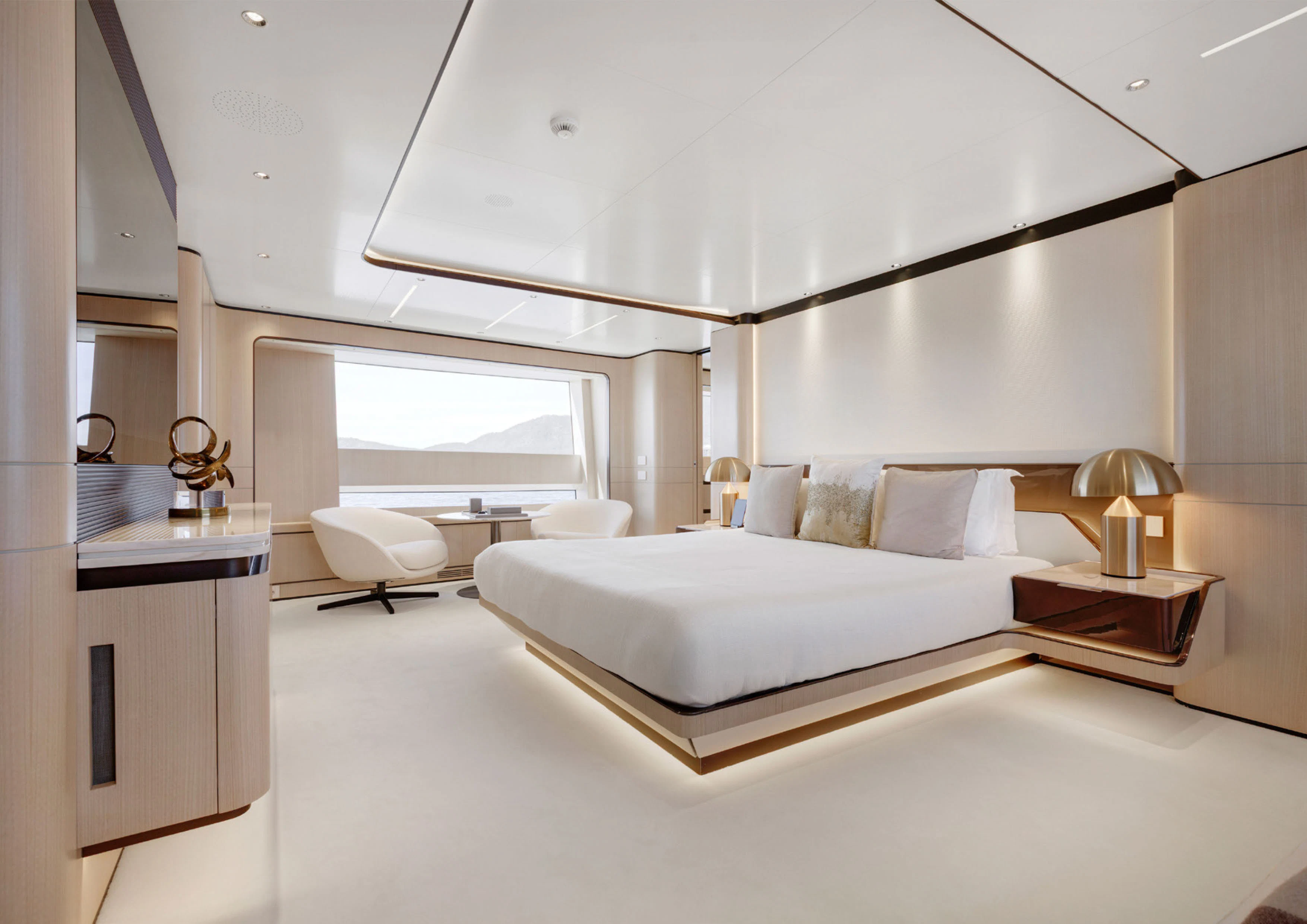 a modern bedroom with a large bed aboard PERLA BIANCA Yacht for Charter