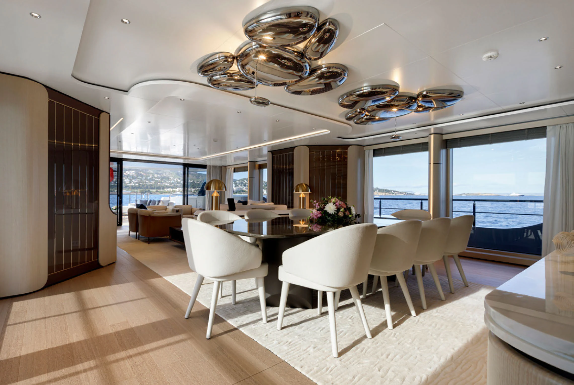 a large room with tables and chairs aboard PERLA BIANCA Yacht for Charter