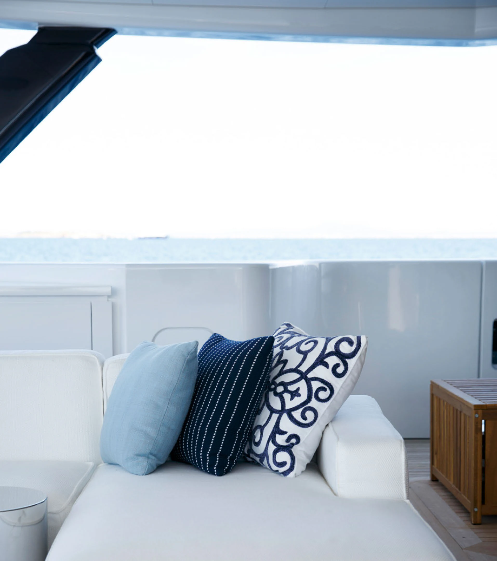 a white couch with pillows aboard PERLA BIANCA Yacht for Charter