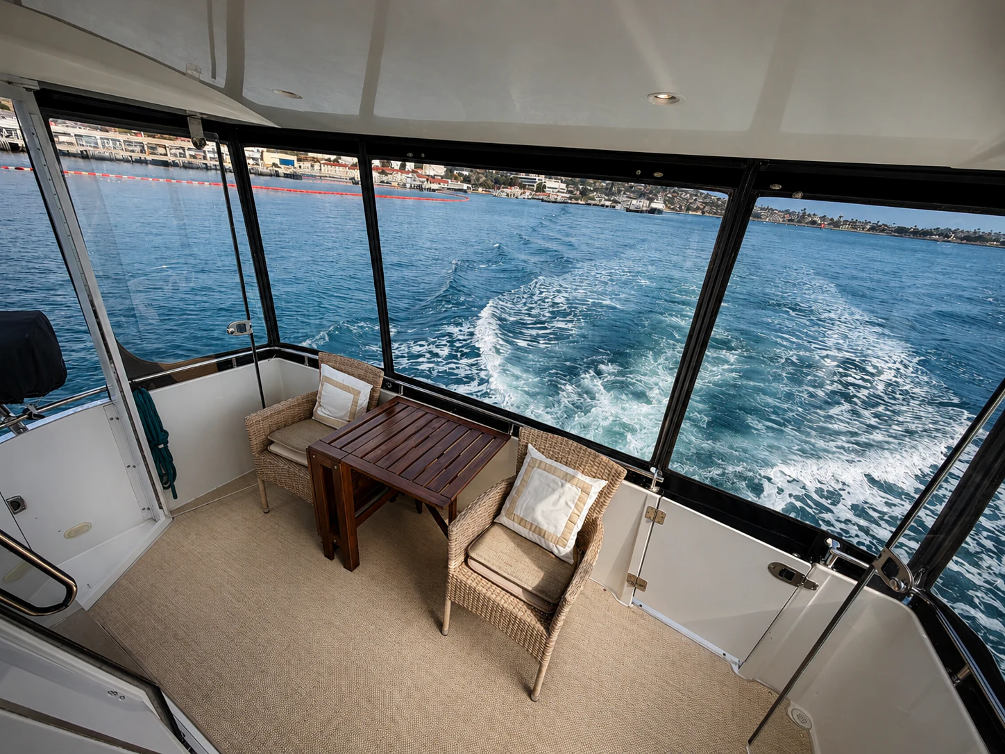 a room with a view of the water and the city aboard PARADIGM Yacht for Sale
