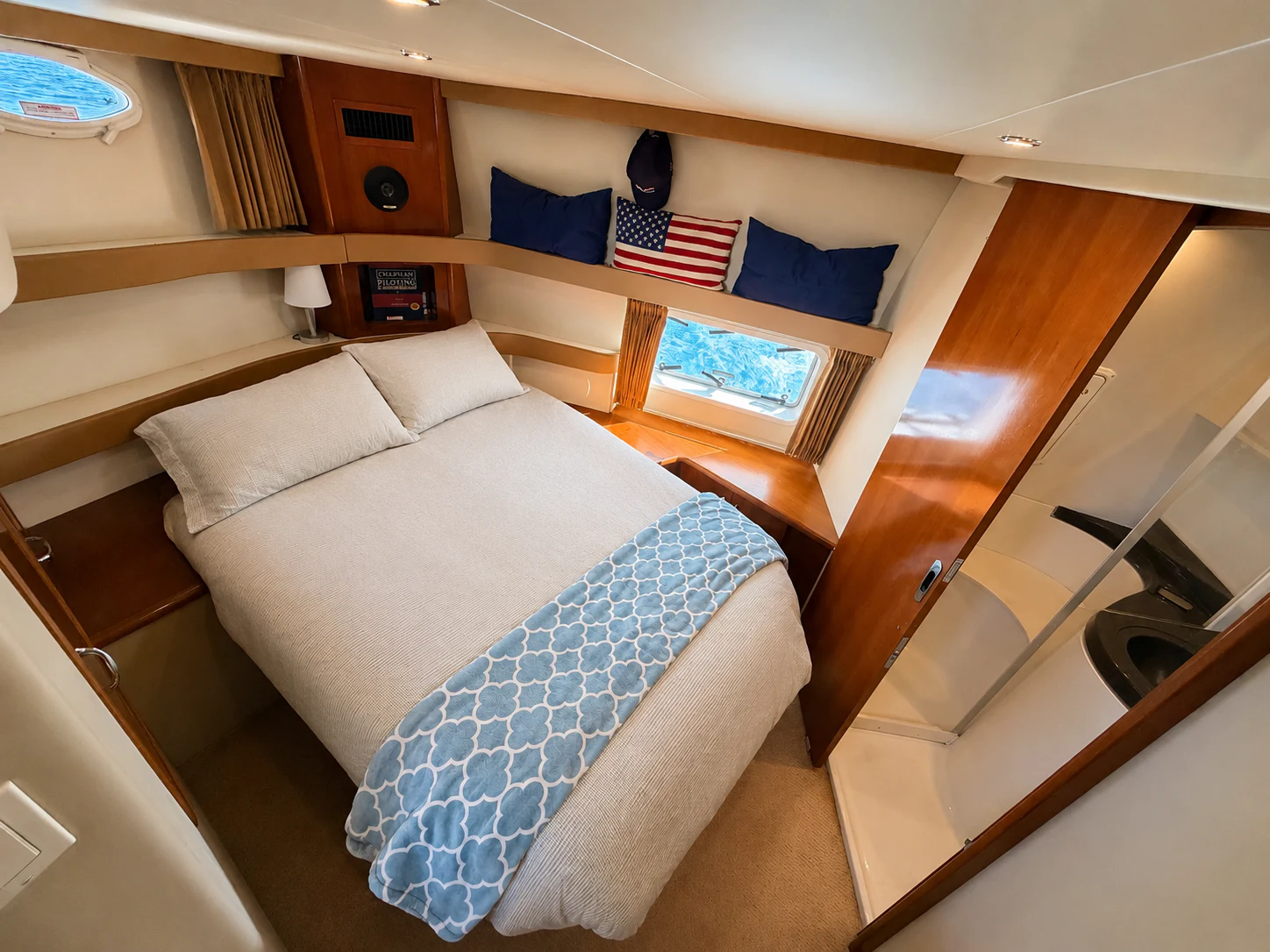 a room with a bed and a television aboard PARADIGM Yacht for Sale