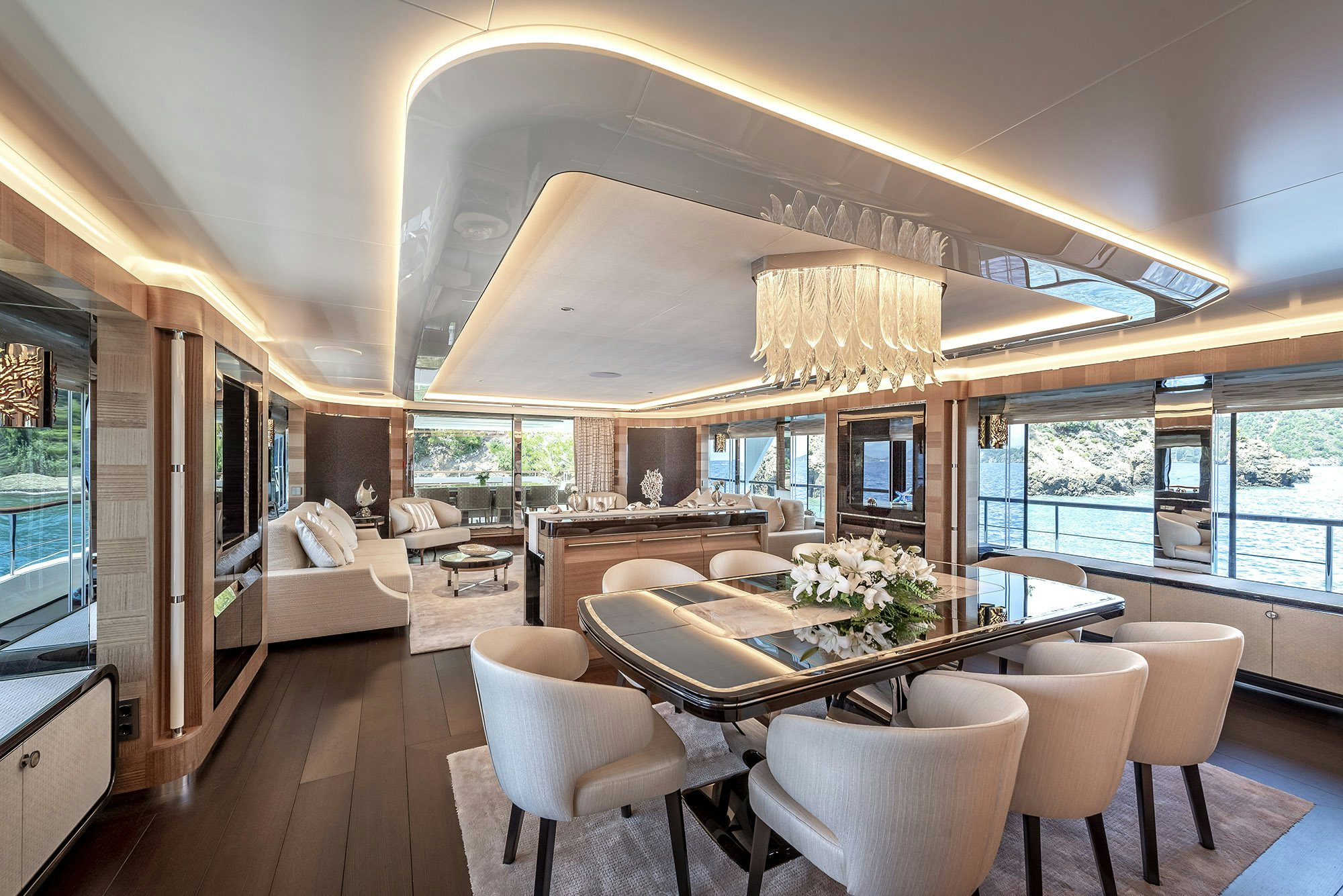 a large room with a table and chairs aboard SUNRISE Yacht for Sale