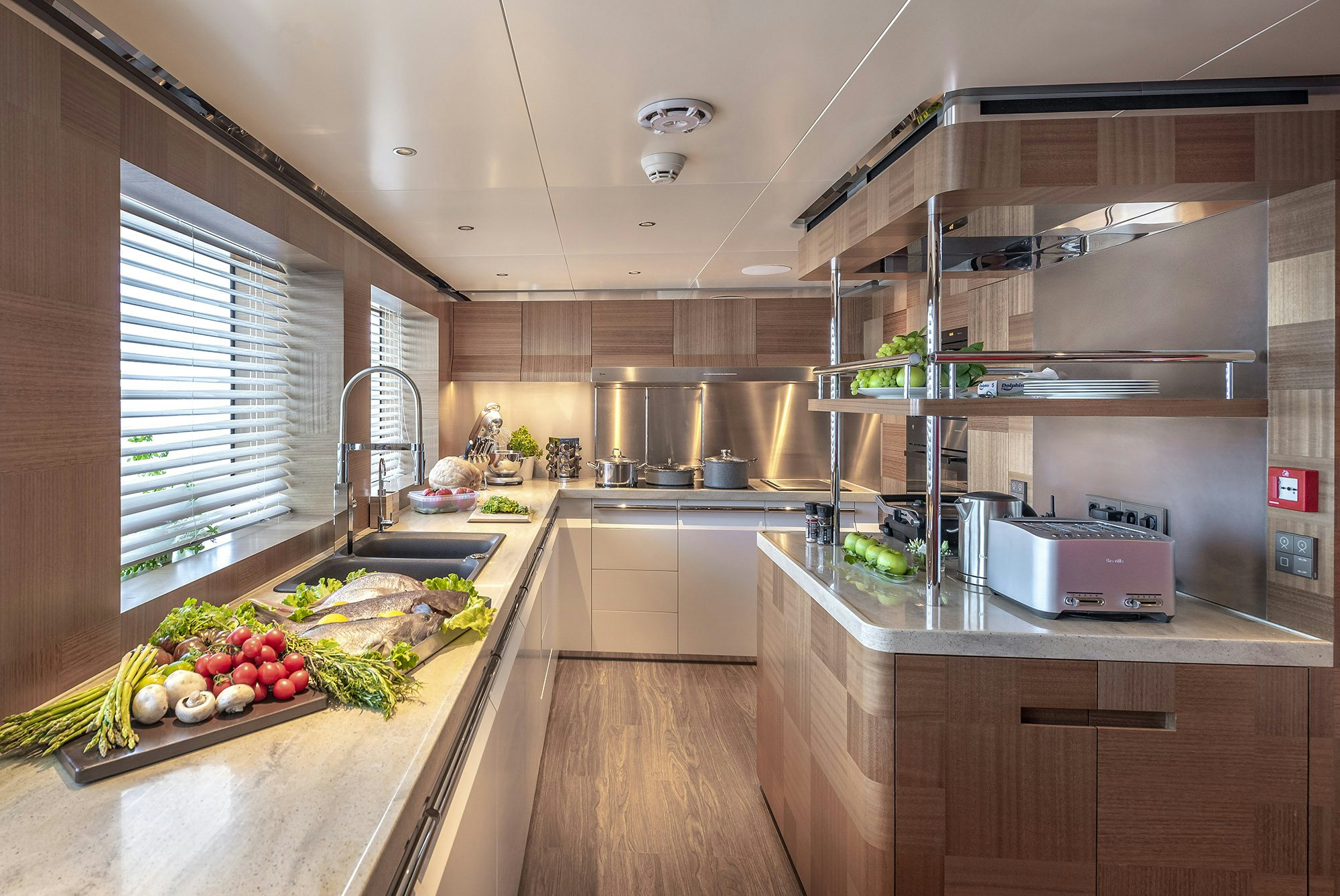 a kitchen with a microwave oven and a refrigerator aboard SUNRISE Yacht for Sale