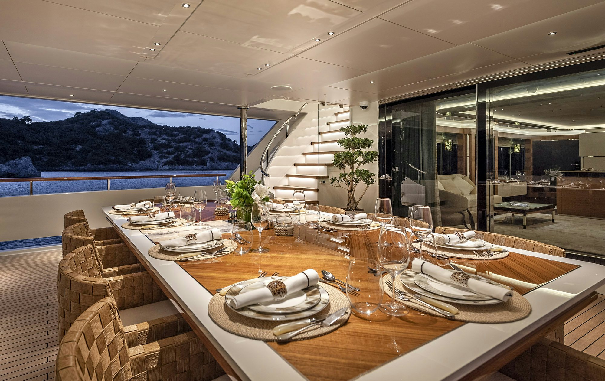 a table set for a dinner aboard SUNRISE Yacht for Sale