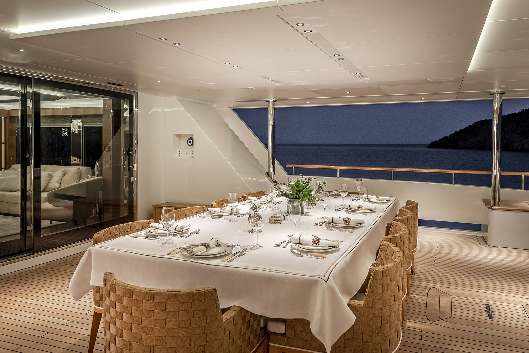 a dining table set for a dinner party aboard SUNRISE Yacht for Sale