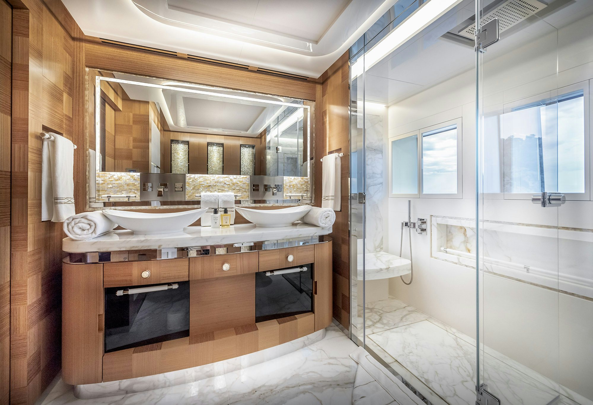 a bathroom with a sink and a shower aboard SUNRISE Yacht for Sale
