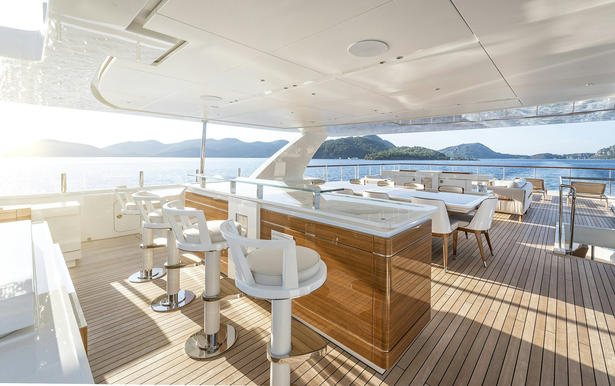 a room with a table and chairs aboard SUNRISE Yacht for Sale