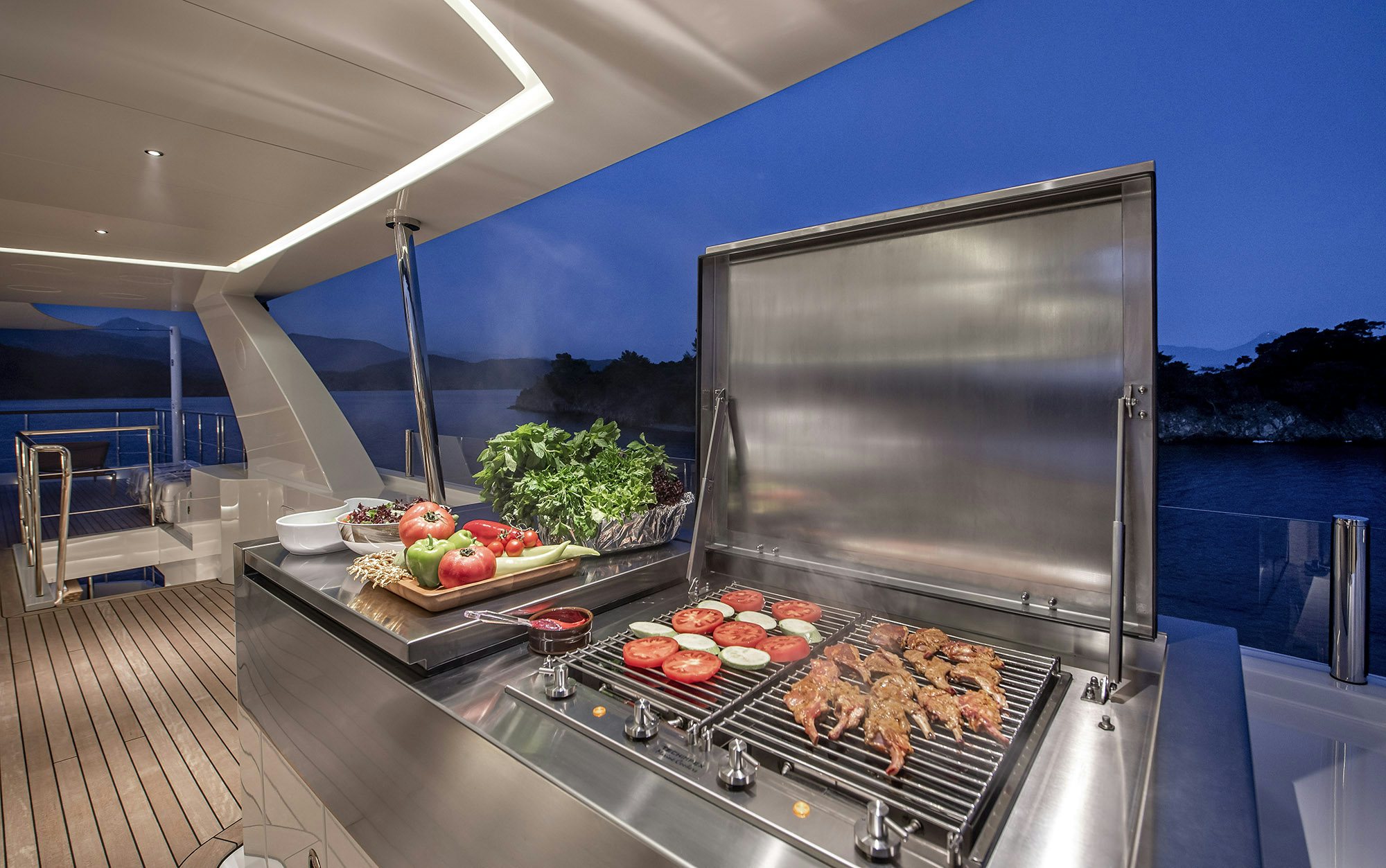 a grill with food on it aboard SUNRISE Yacht for Sale