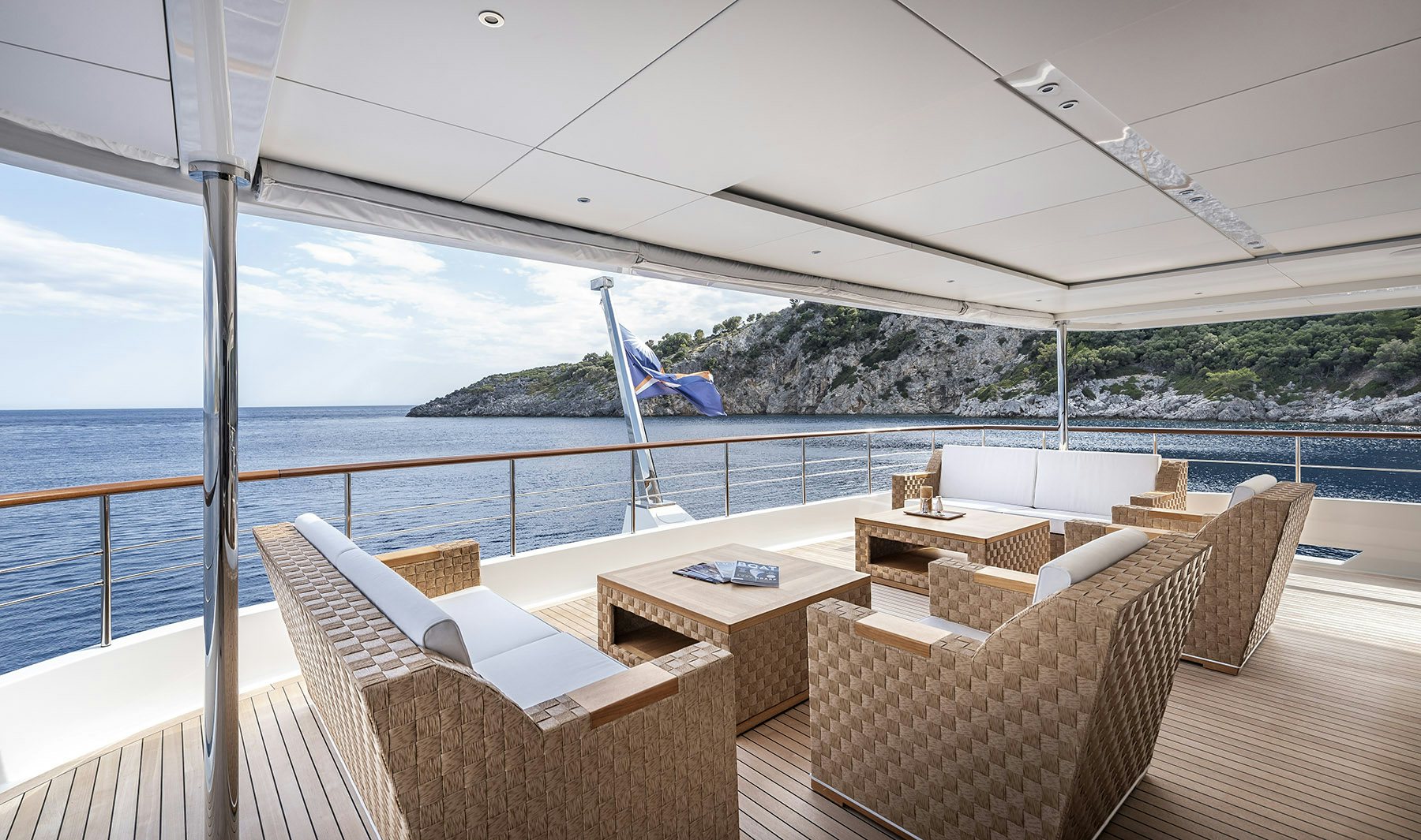 a deck with chairs and a view of a plane in the sky aboard SUNRISE Yacht for Sale
