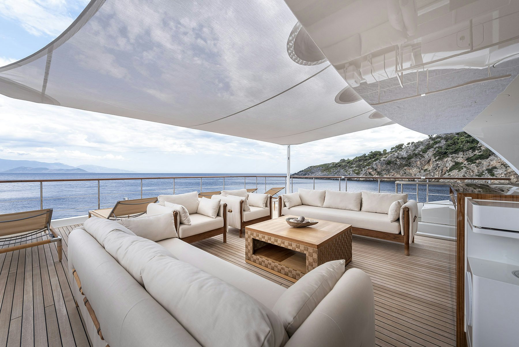 a large white room with a large balcony overlooking a large body of water aboard SUNRISE Yacht for Sale