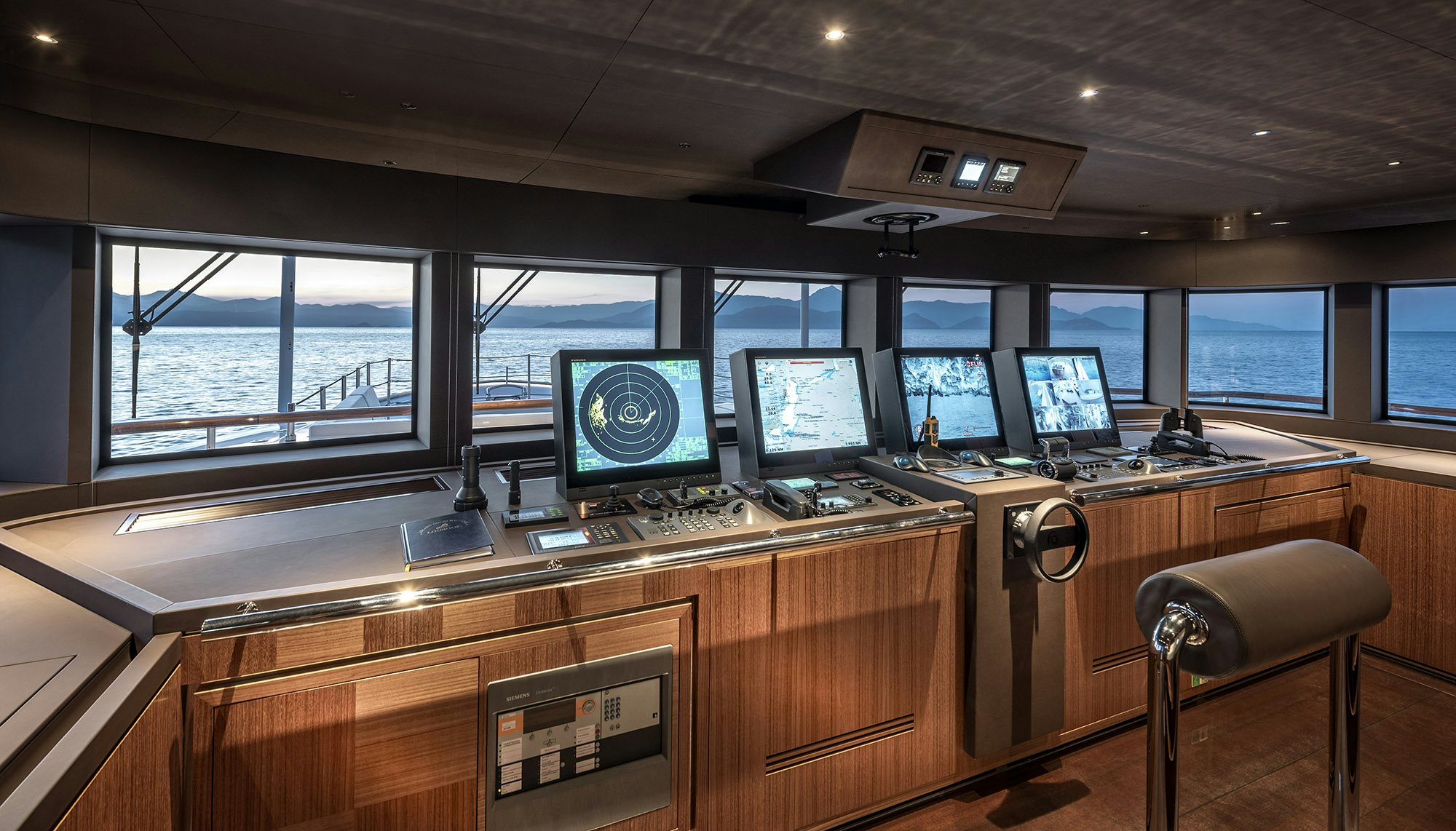 a room with computers and monitors aboard SUNRISE Yacht for Sale