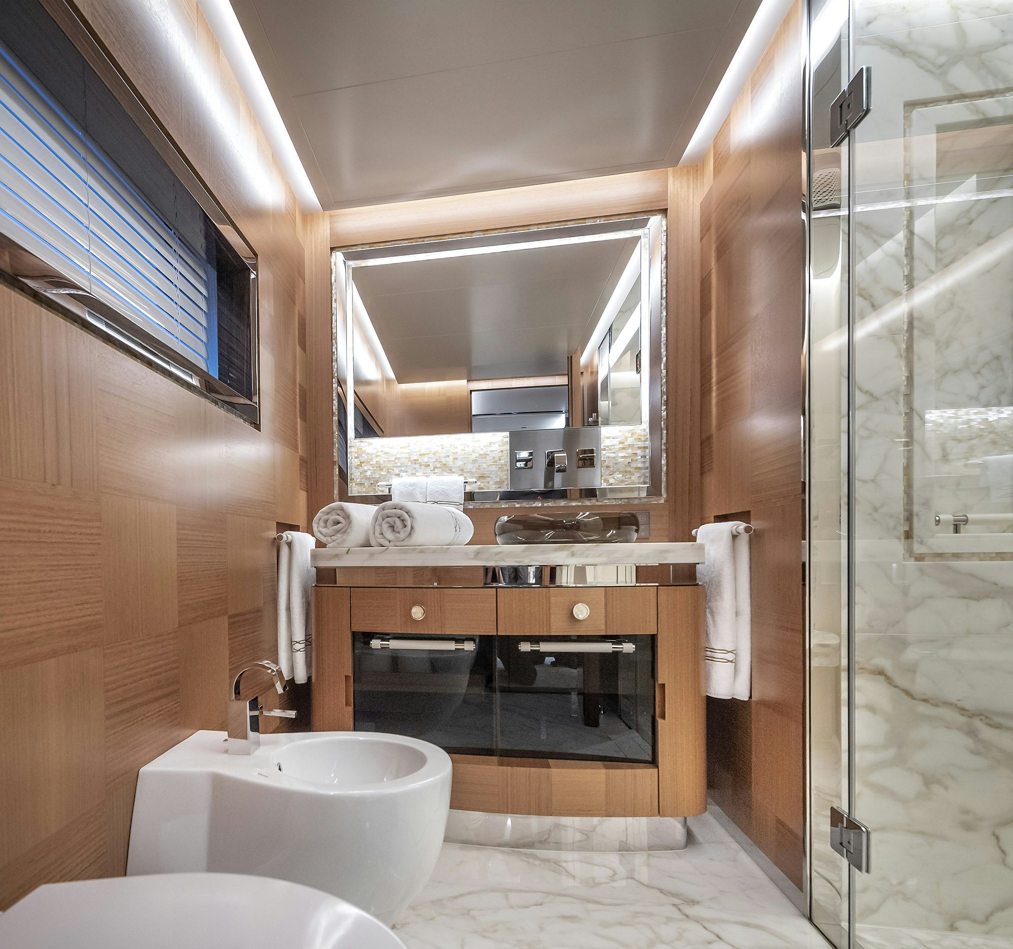 a bathroom with a glass shower aboard SUNRISE Yacht for Sale