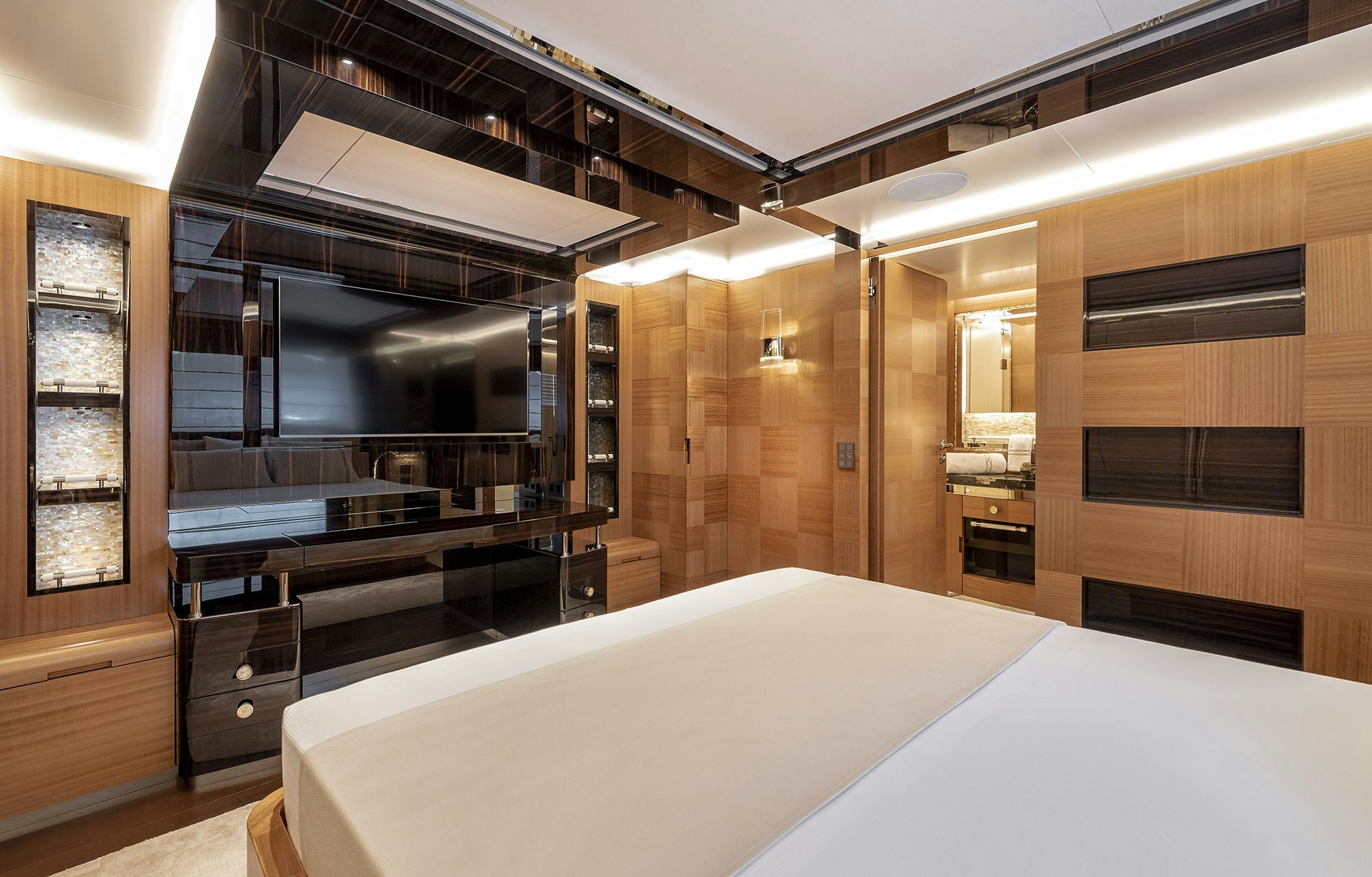 a large room with a bed and a large mirror aboard SUNRISE Yacht for Sale