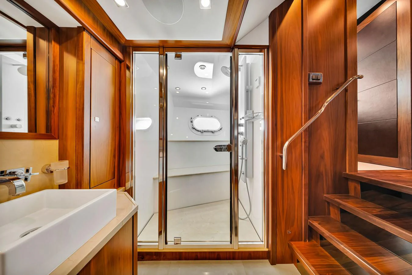 a bathroom with a shower unit and sink aboard NATURAL 9 Yacht for Charter