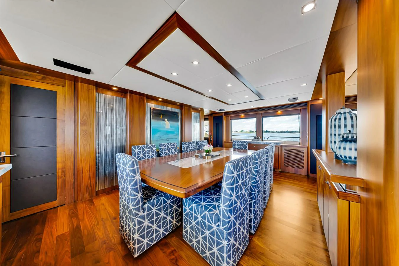 a dining room with a large table aboard NATURAL 9 Yacht for Charter