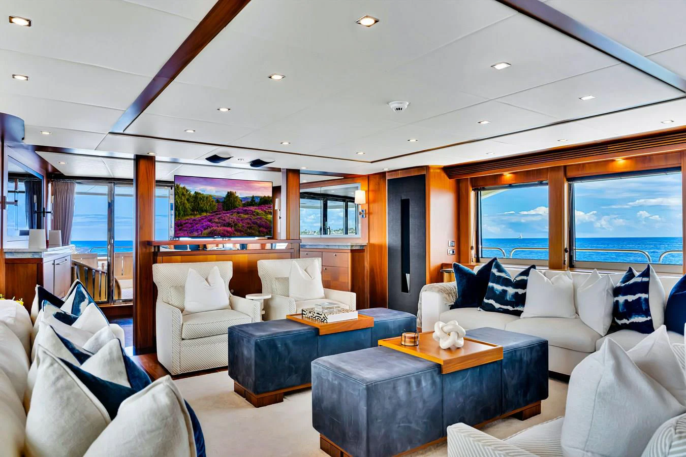 a living room with a large window aboard NATURAL 9 Yacht for Charter