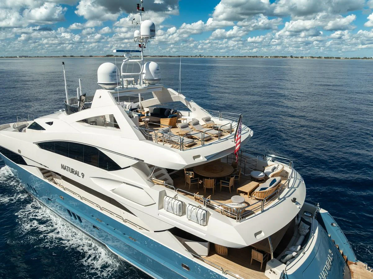 a large white boat in the water aboard NATURAL 9 Yacht for Charter