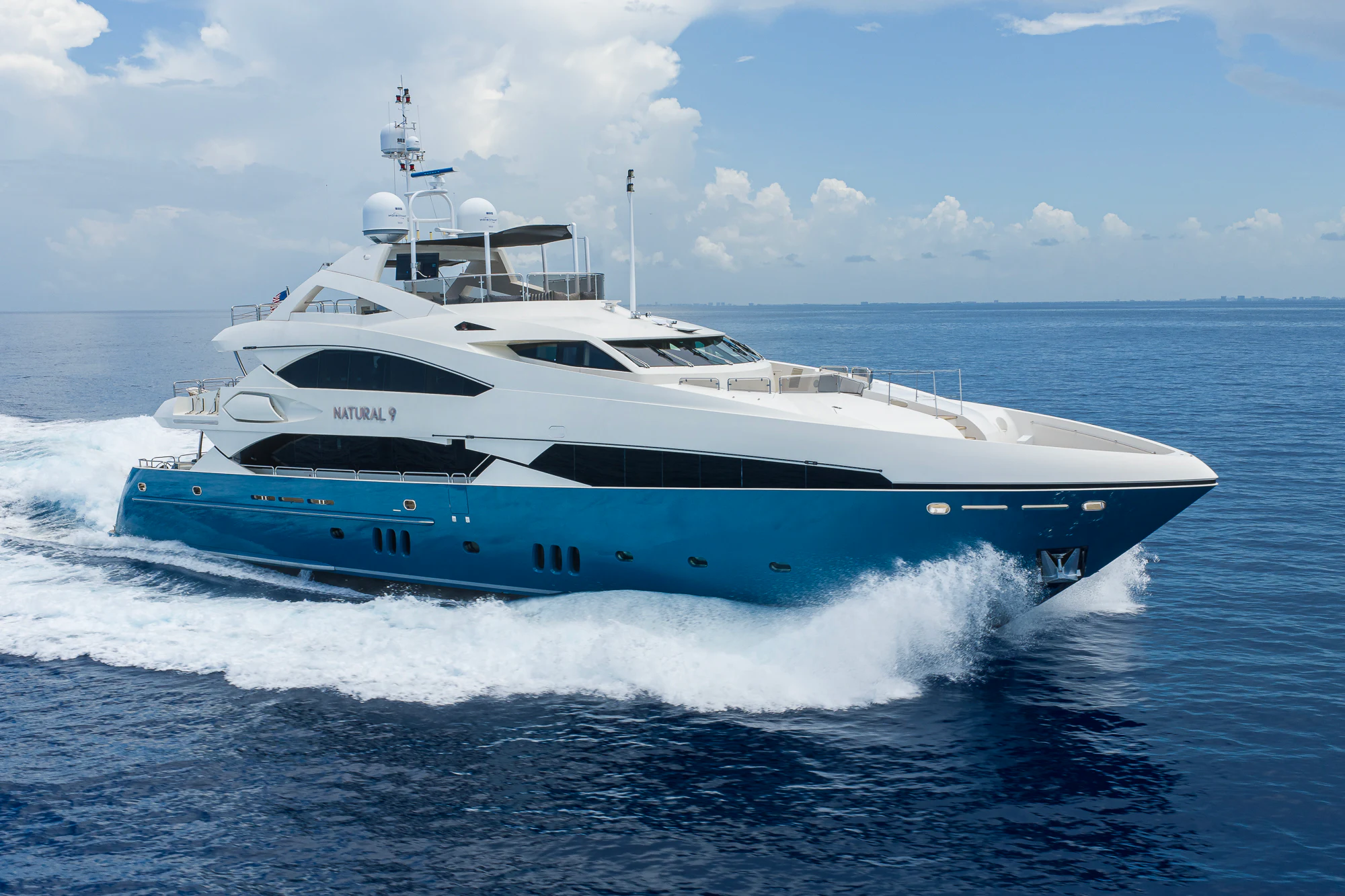 a white yacht on the water aboard NATURAL 9 Yacht for Sale