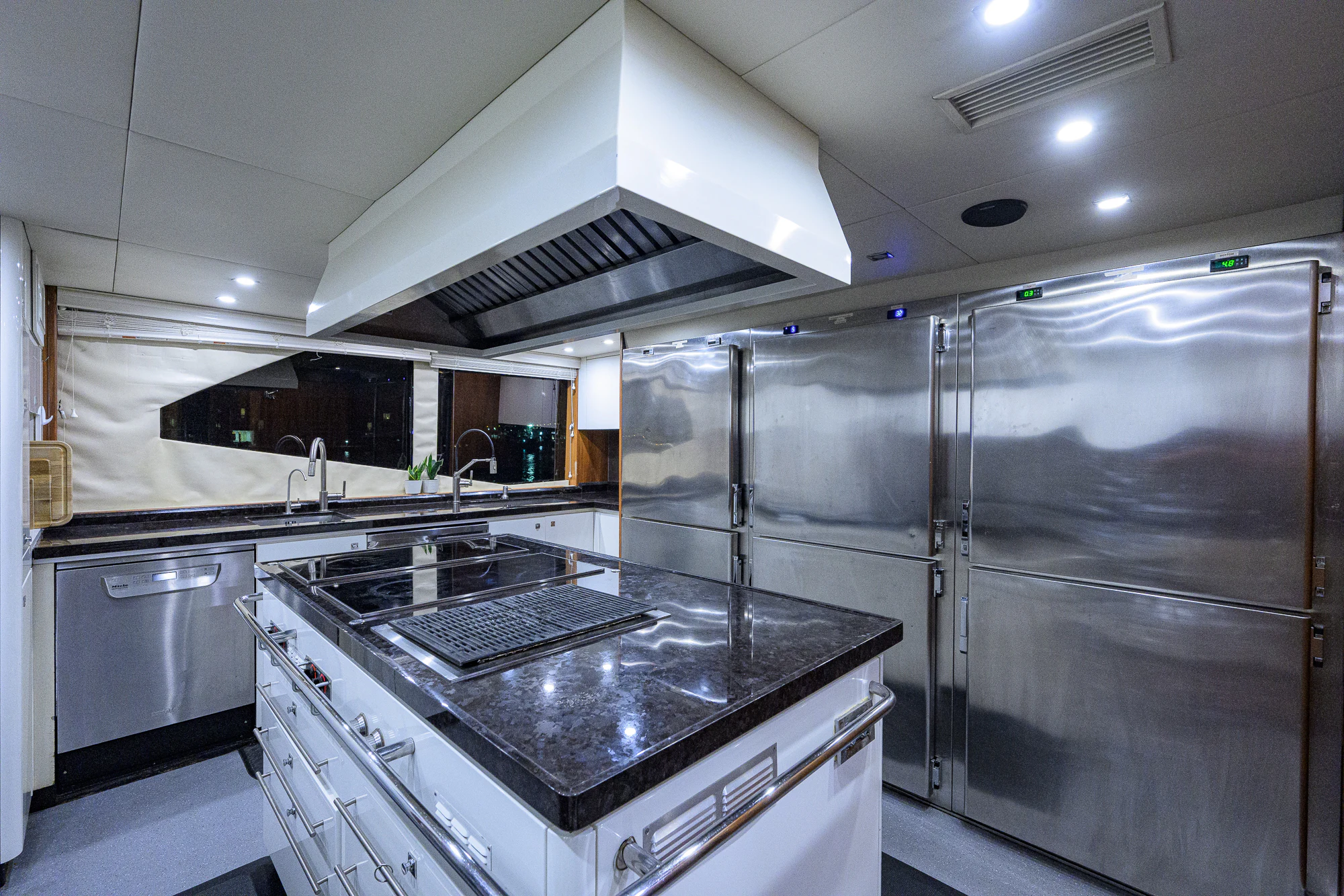 a kitchen with stainless steel appliances aboard NATURAL 9 Yacht for Sale