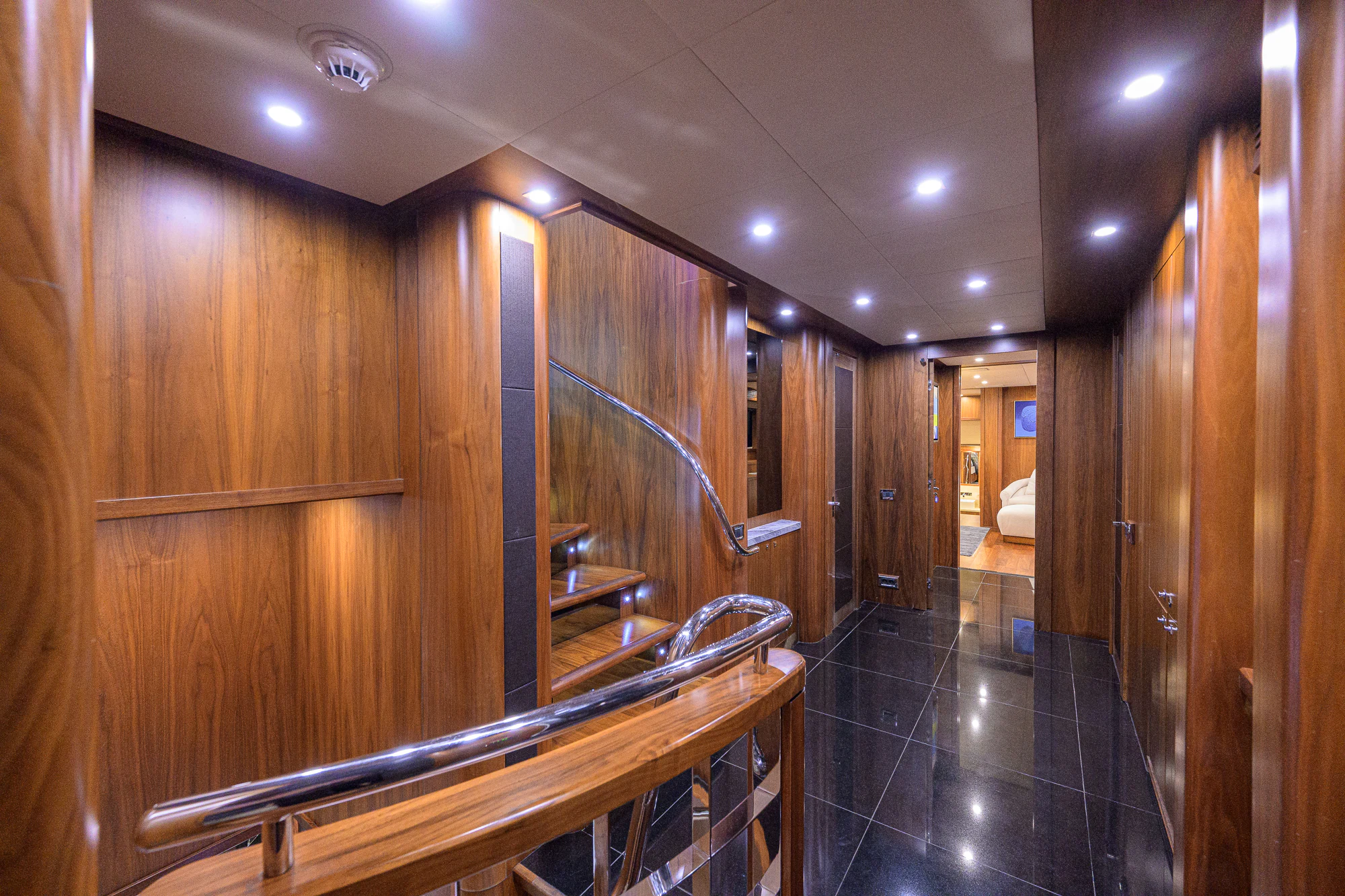 a bathroom with wood cabinets aboard NATURAL 9 Yacht for Sale