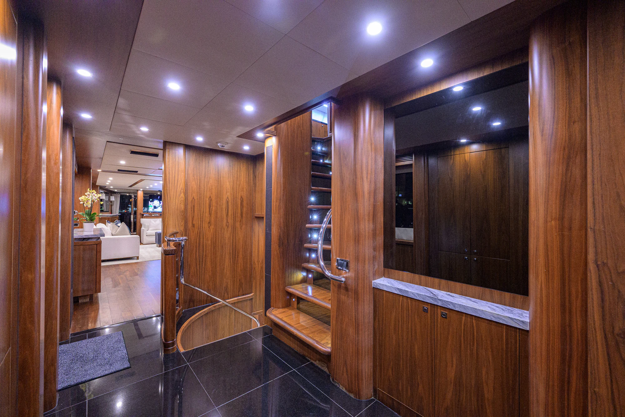 a large bathroom with wooden cabinets aboard NATURAL 9 Yacht for Sale