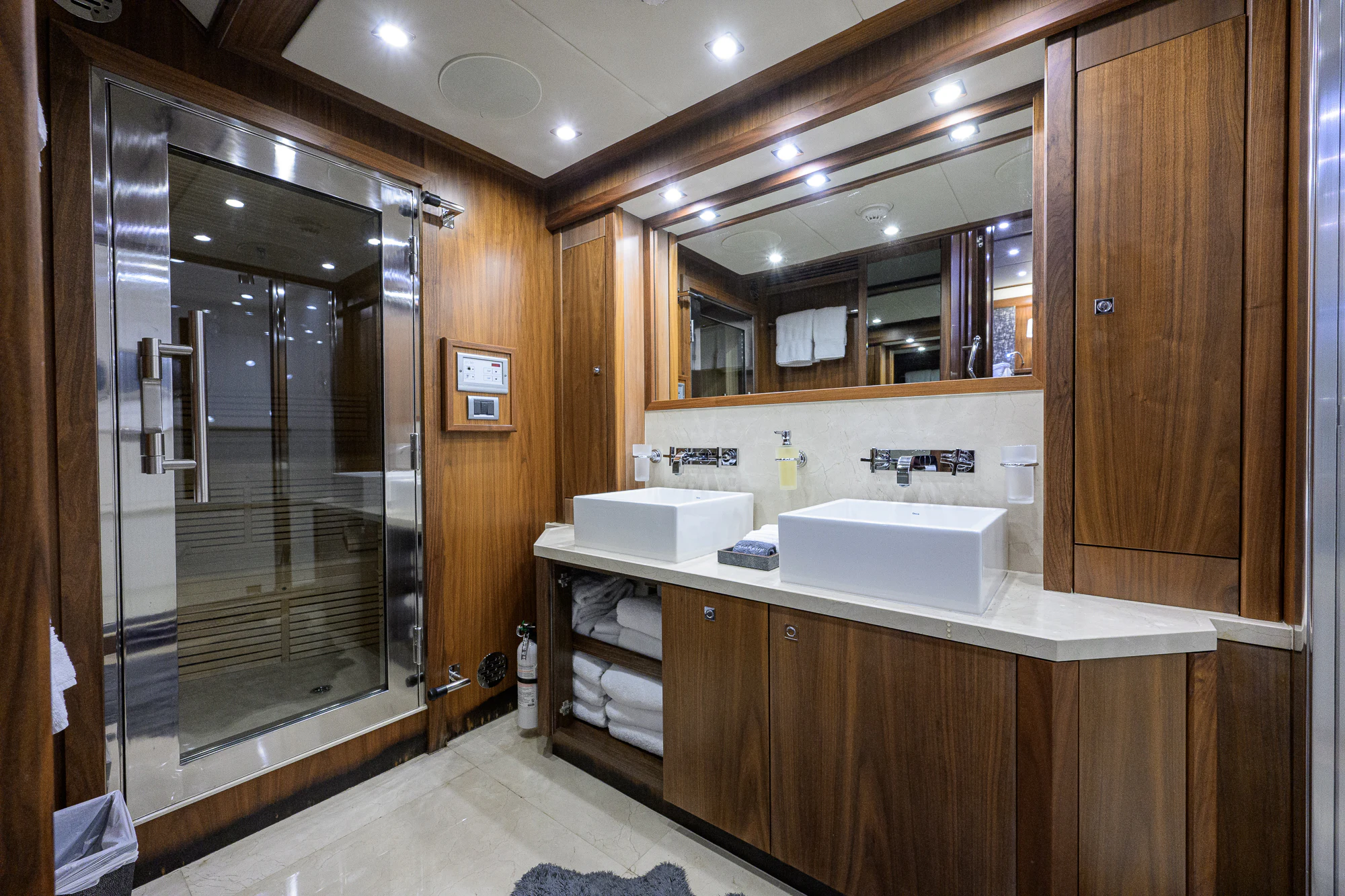 a bathroom with a large glass shower aboard NATURAL 9 Yacht for Sale
