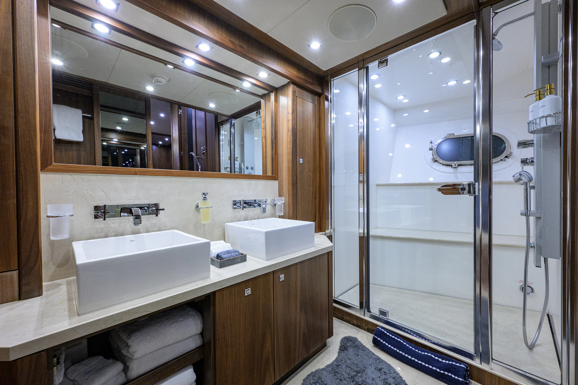 a bathroom with a sink and a shower aboard NATURAL 9 Yacht for Sale