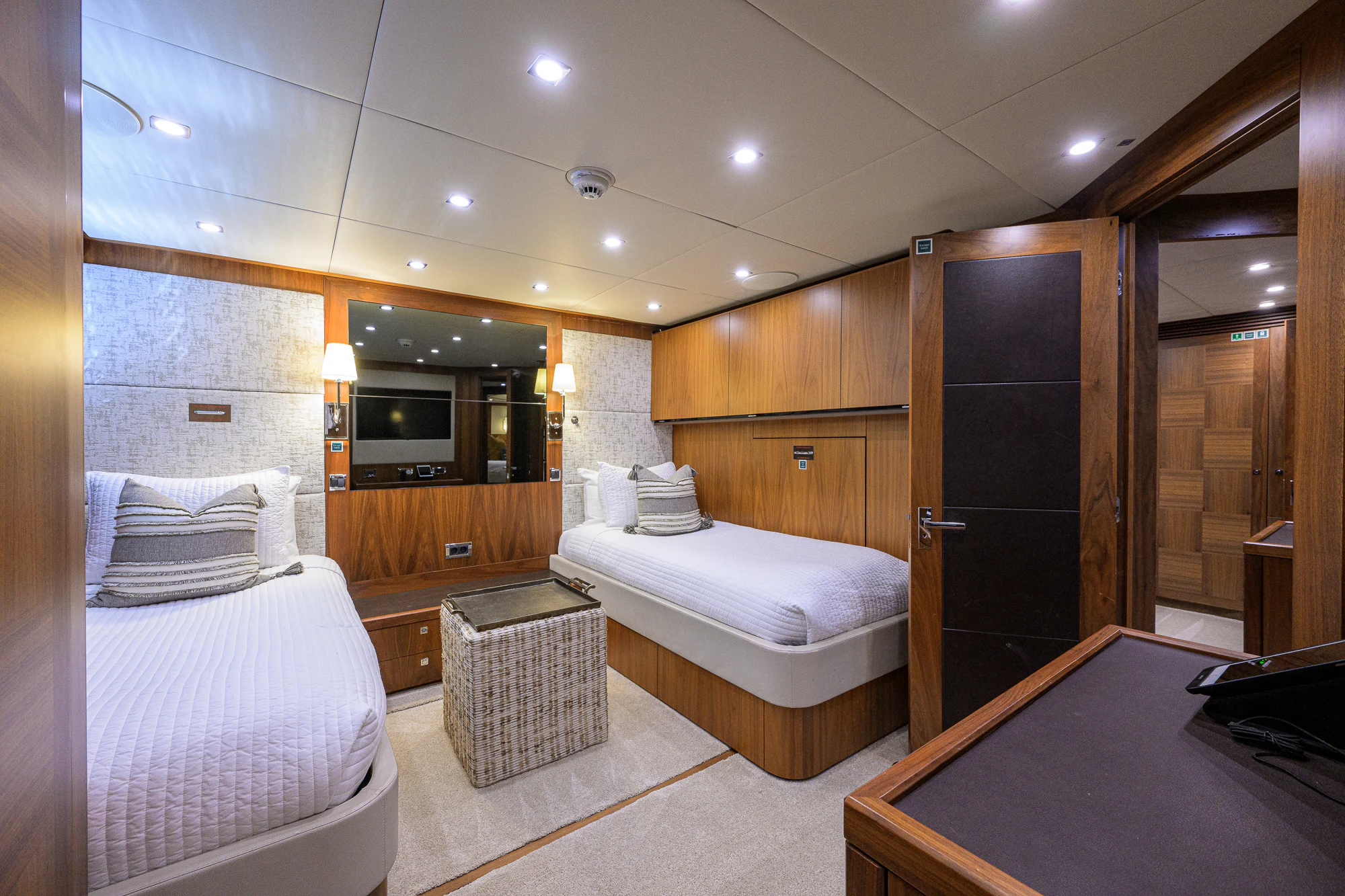 a room with a bed and a desk aboard NATURAL 9 Yacht for Sale