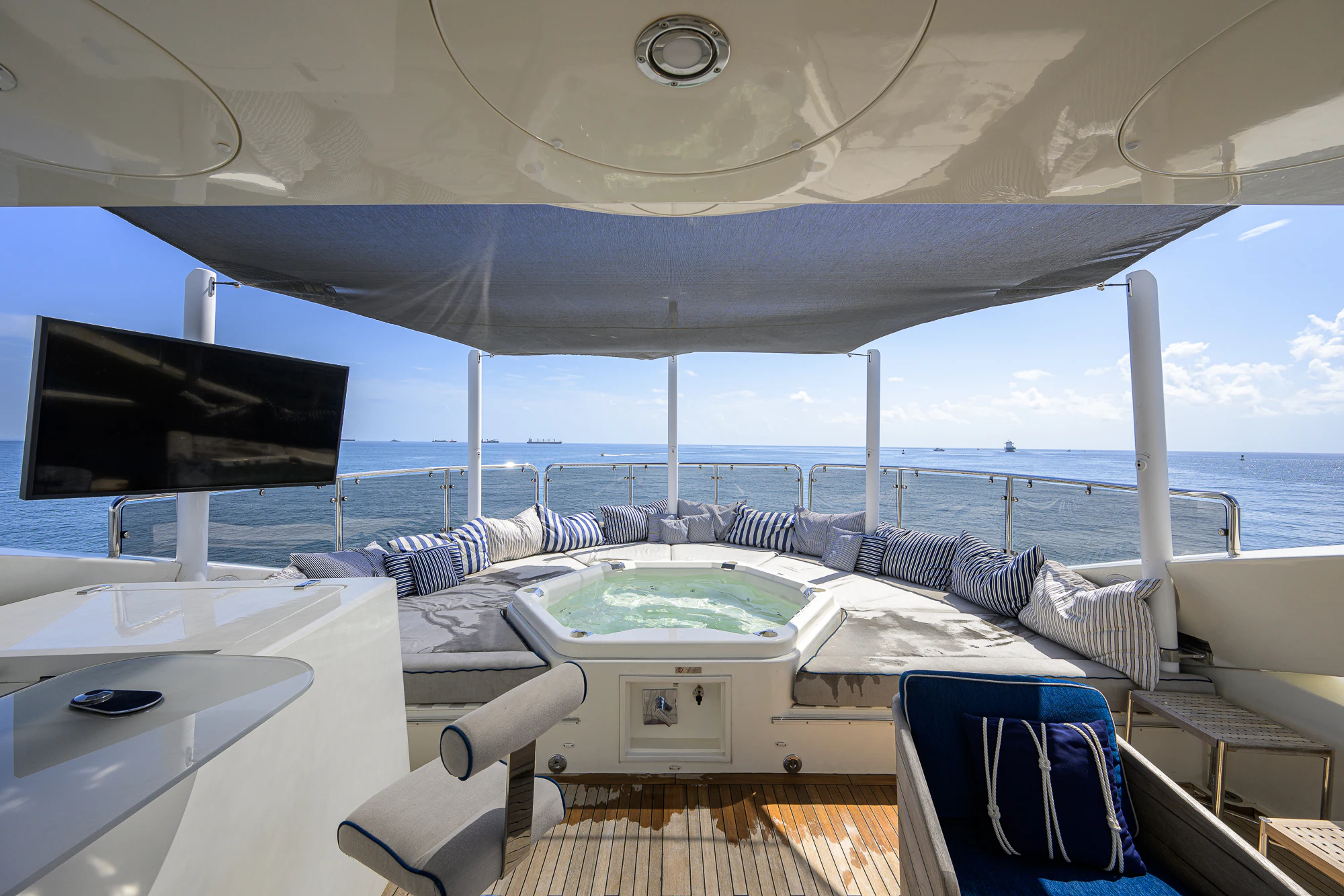 a boat with a table and chairs aboard NATURAL 9 Yacht for Sale