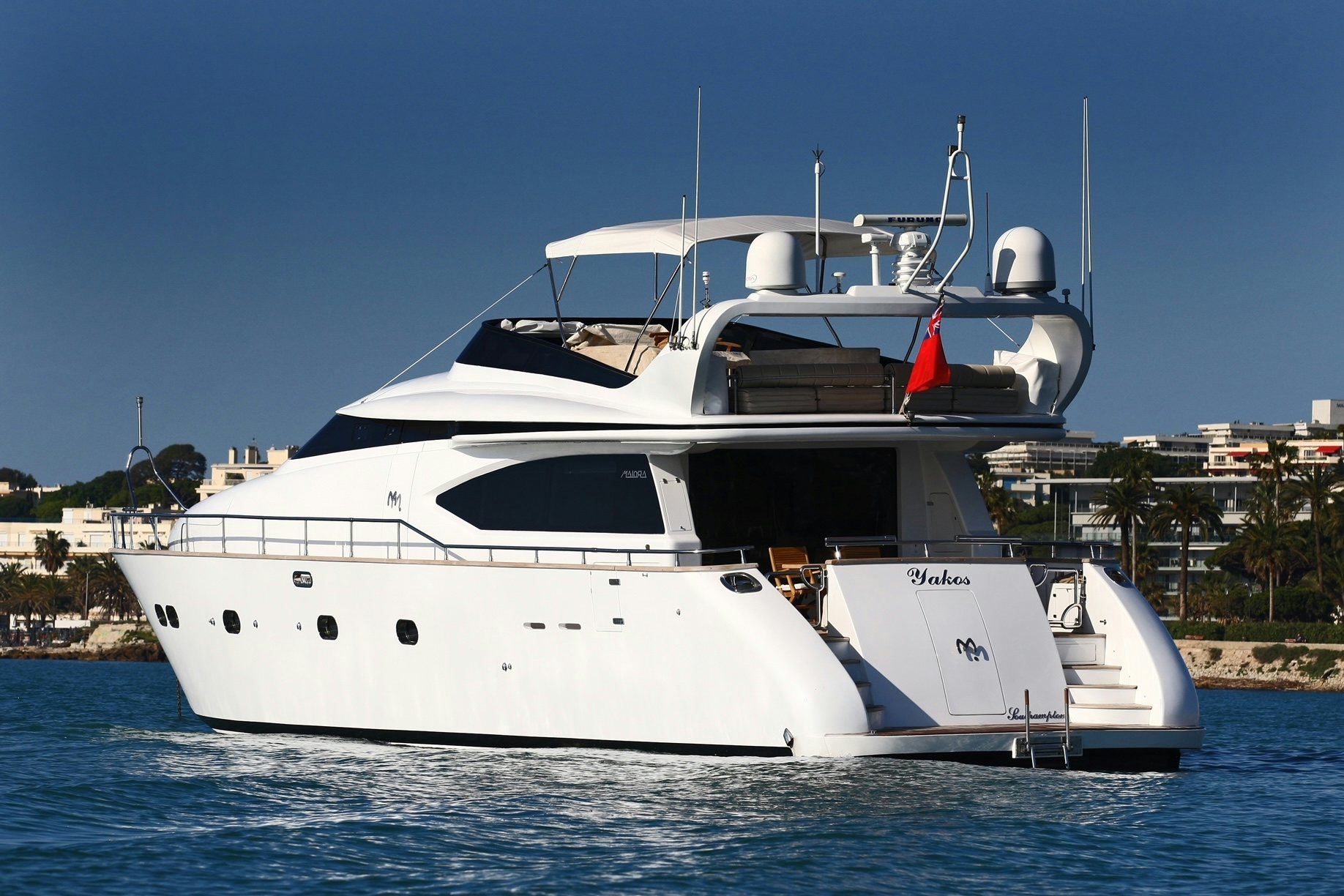 a white yacht in the water aboard YAKOS Yacht for Sale