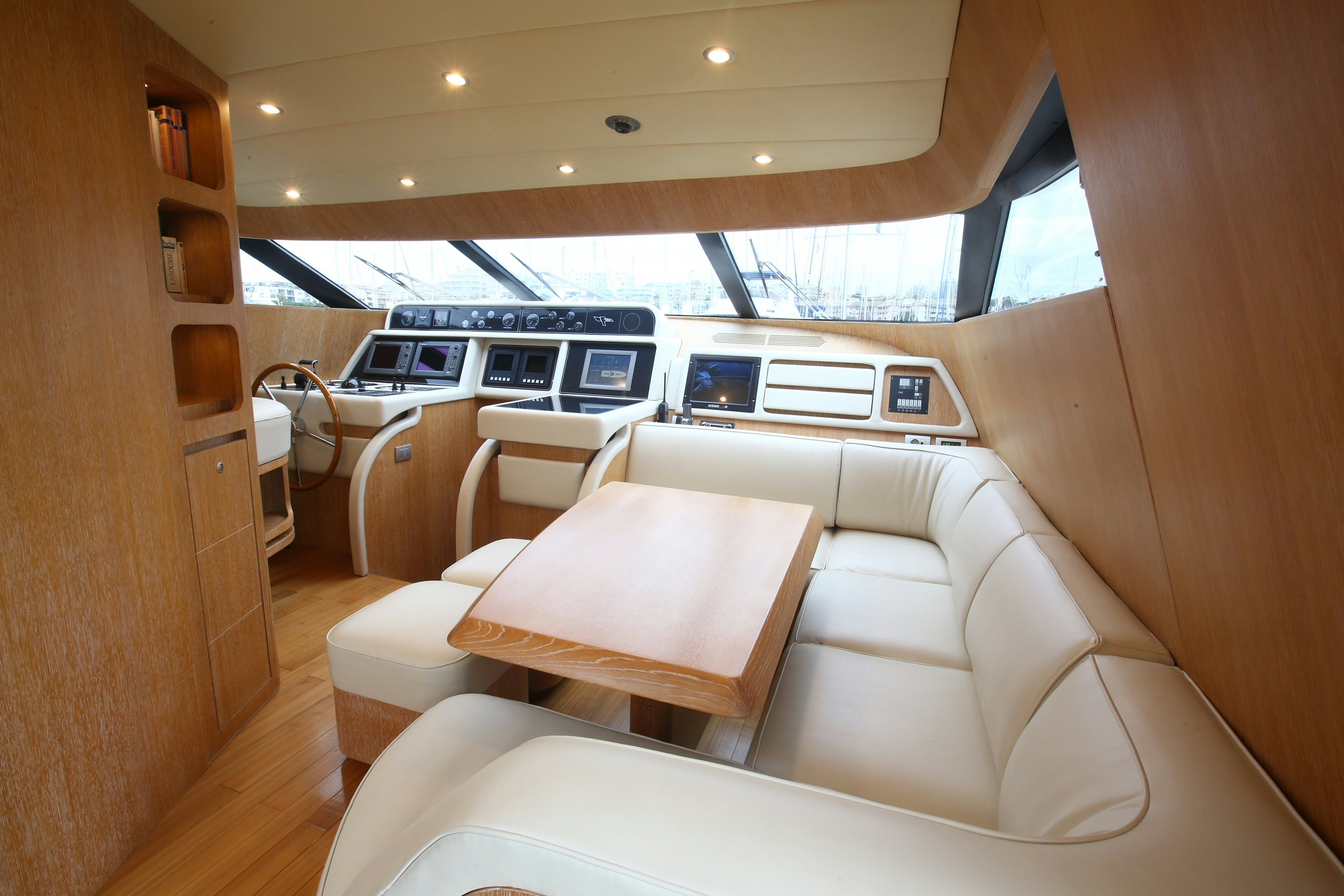 a room with a couch and a table aboard YAKOS Yacht for Sale