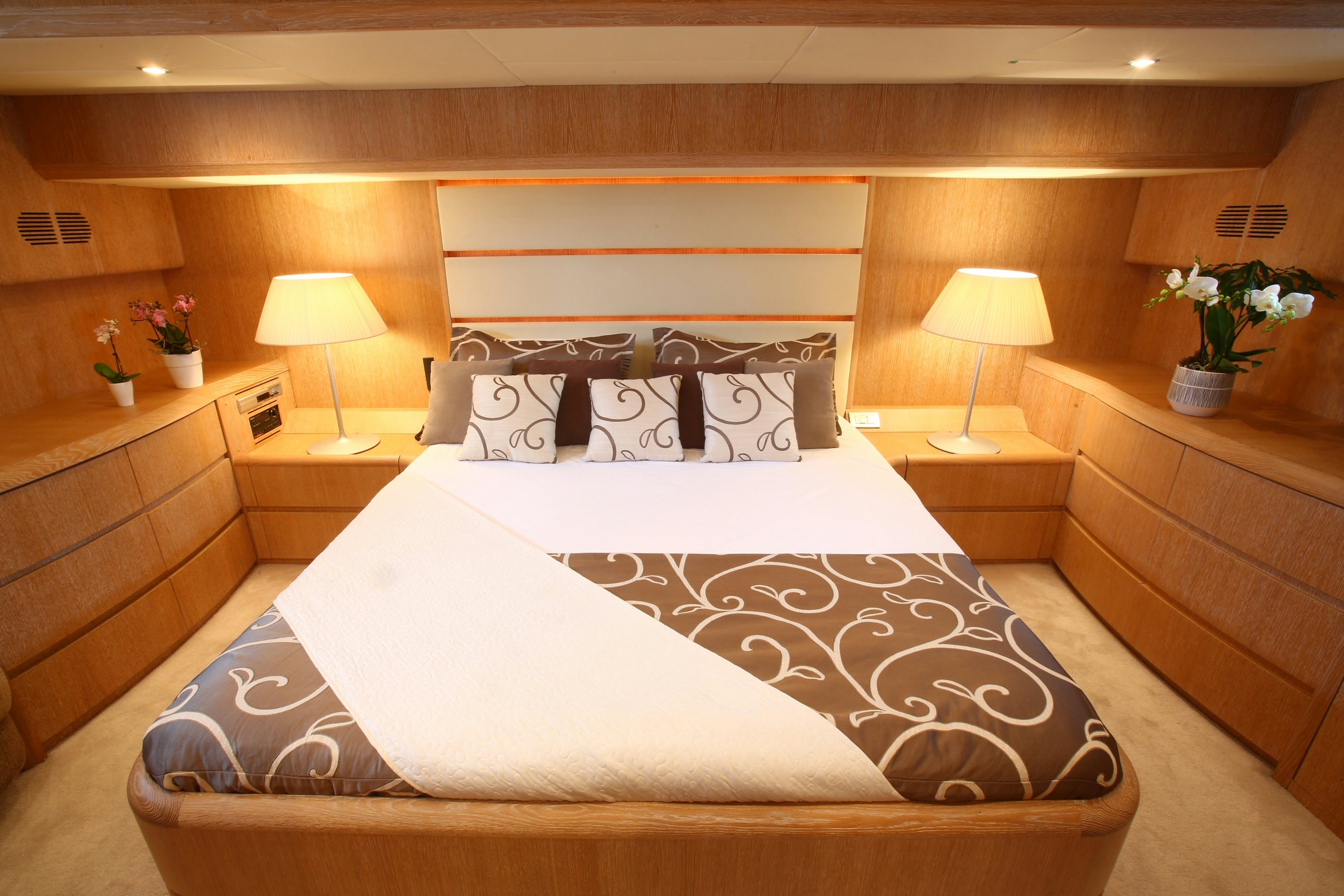 a bed with a white sheet aboard YAKOS Yacht for Sale