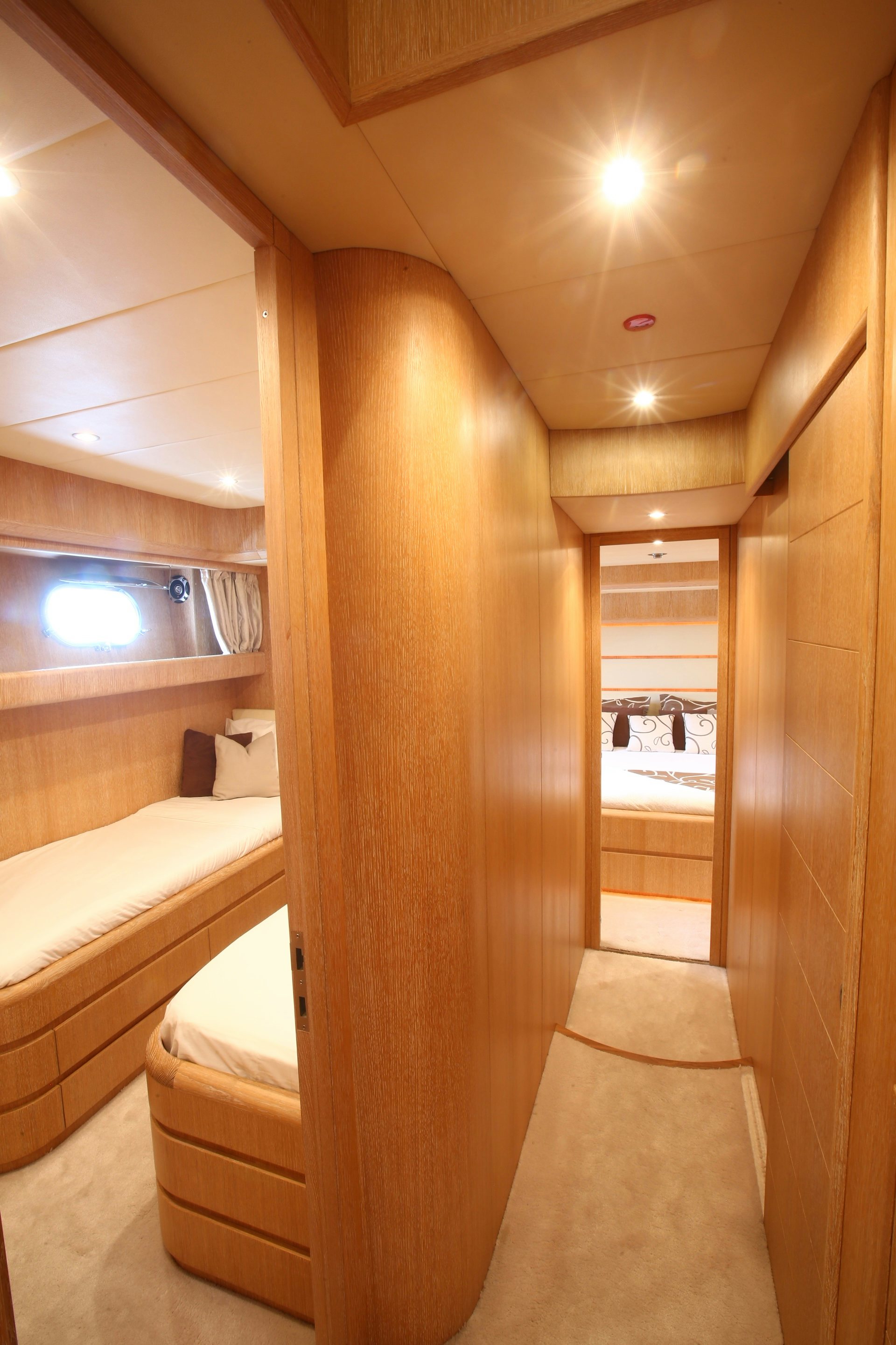 a room with a staircase and a ceiling with lights aboard YAKOS Yacht for Sale