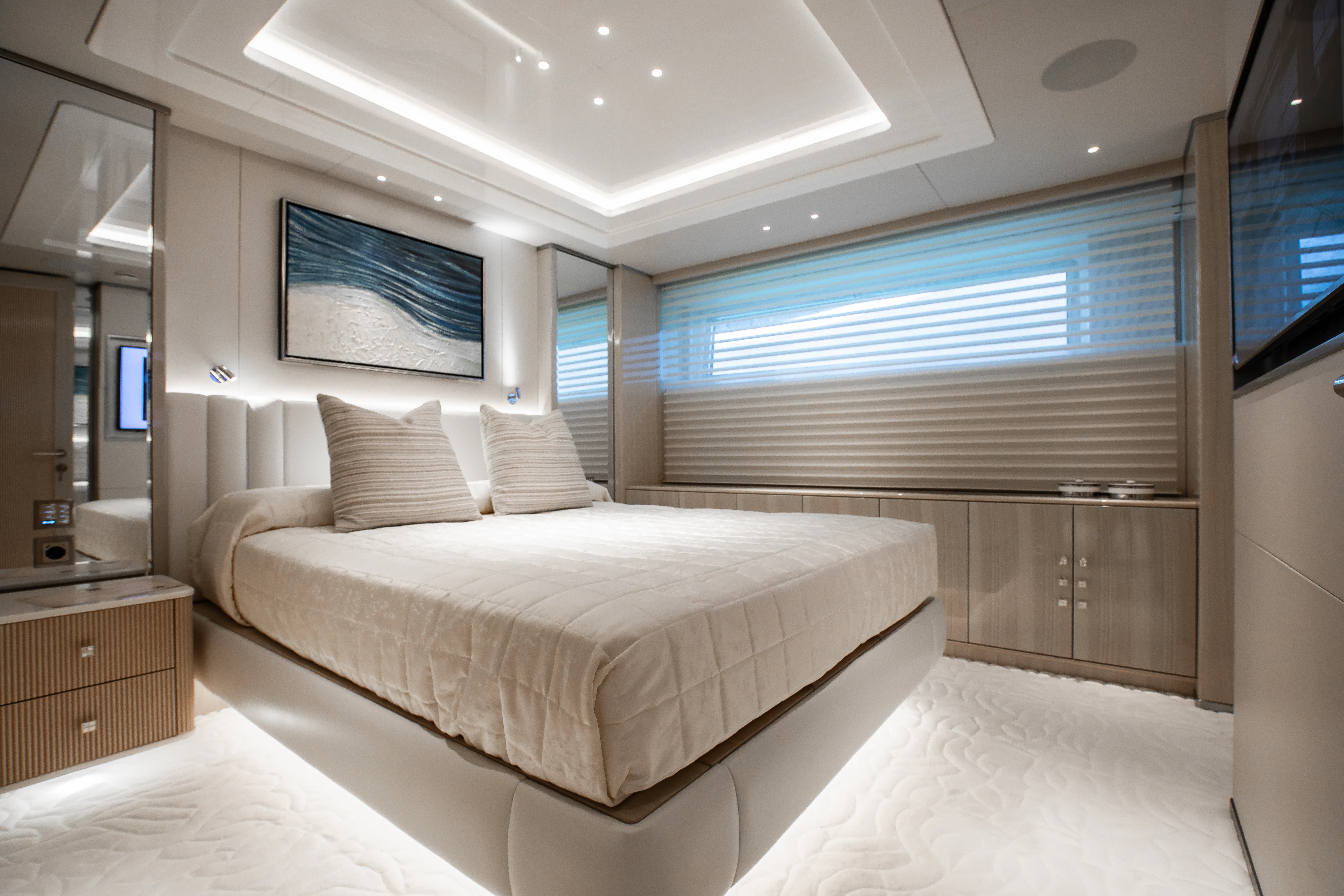 a room with a bed and a window aboard PERSEVERANCE Yacht for Charter