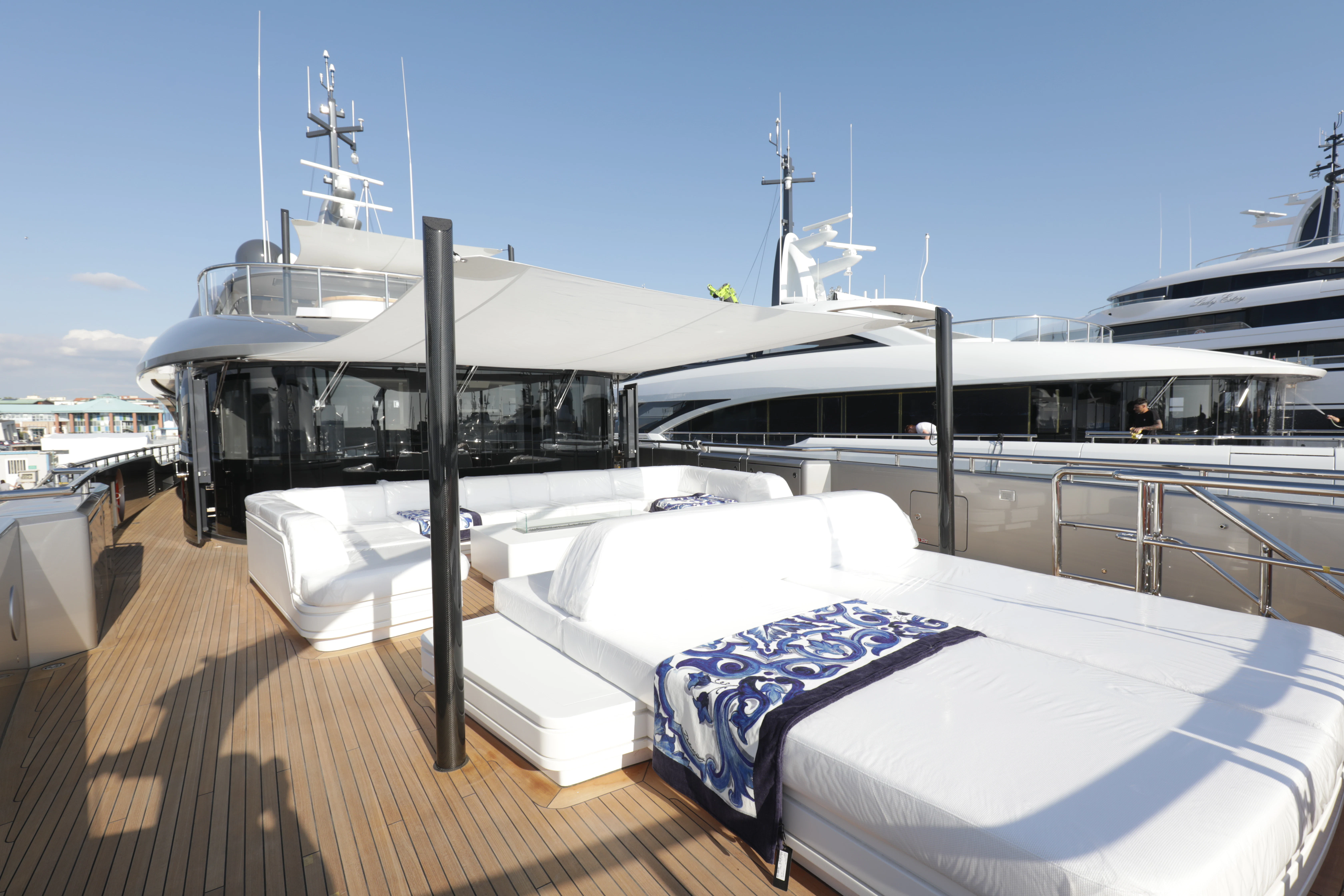 a large white boat with blue and white sheets aboard PERSEVERANCE Yacht for Charter