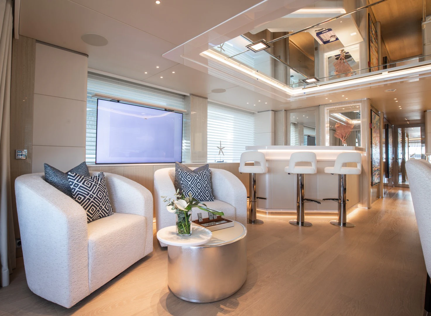 a living room with a couch and a table aboard PERSEVERANCE Yacht for Charter