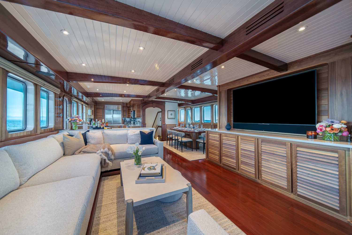 a living room with a large screen aboard SURFBIRD Yacht for Charter