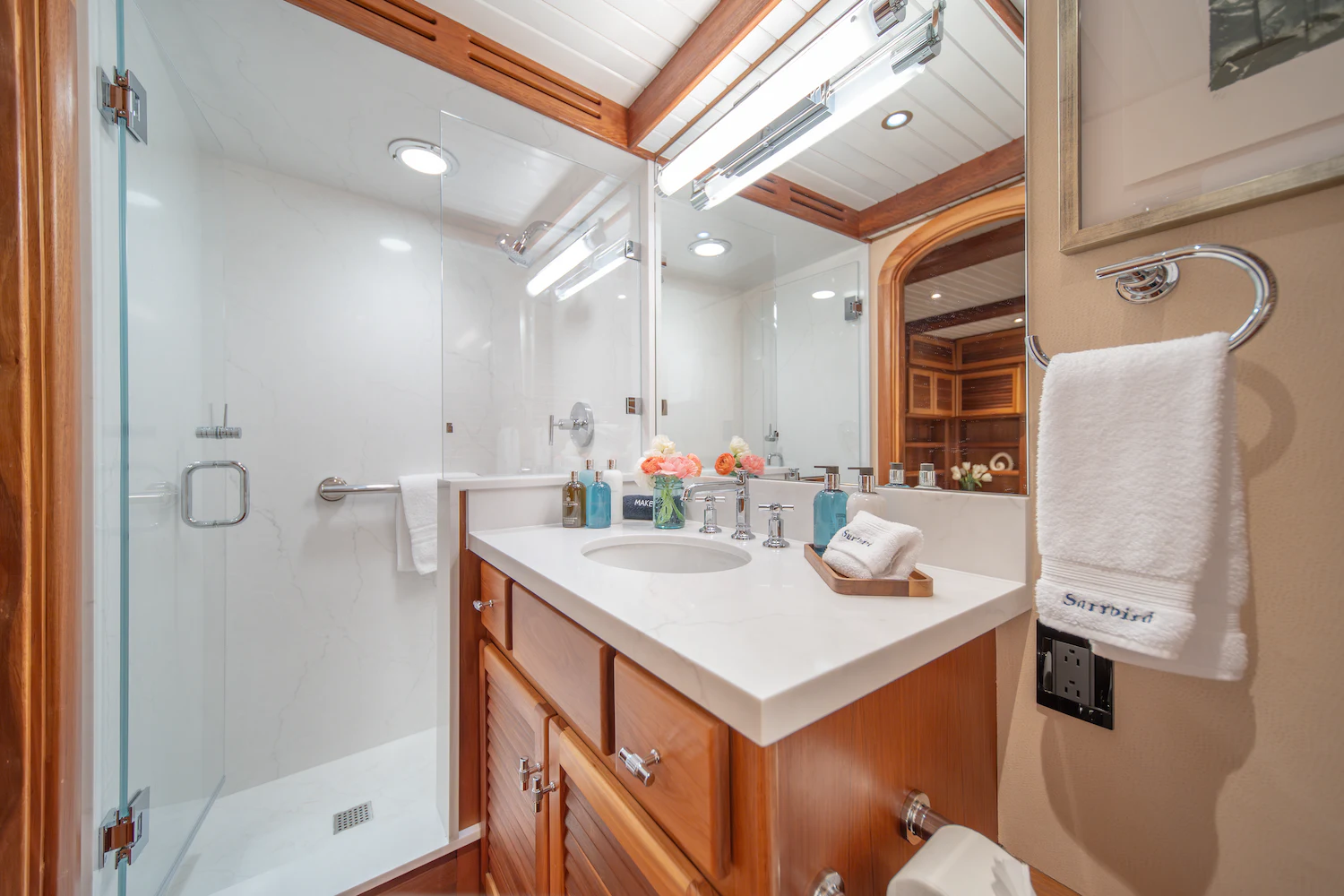 a bathroom with a sink and a shower aboard SURFBIRD Yacht for Charter