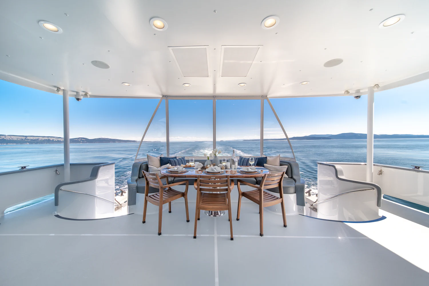 a table and chairs on a deck aboard SURFBIRD Yacht for Charter