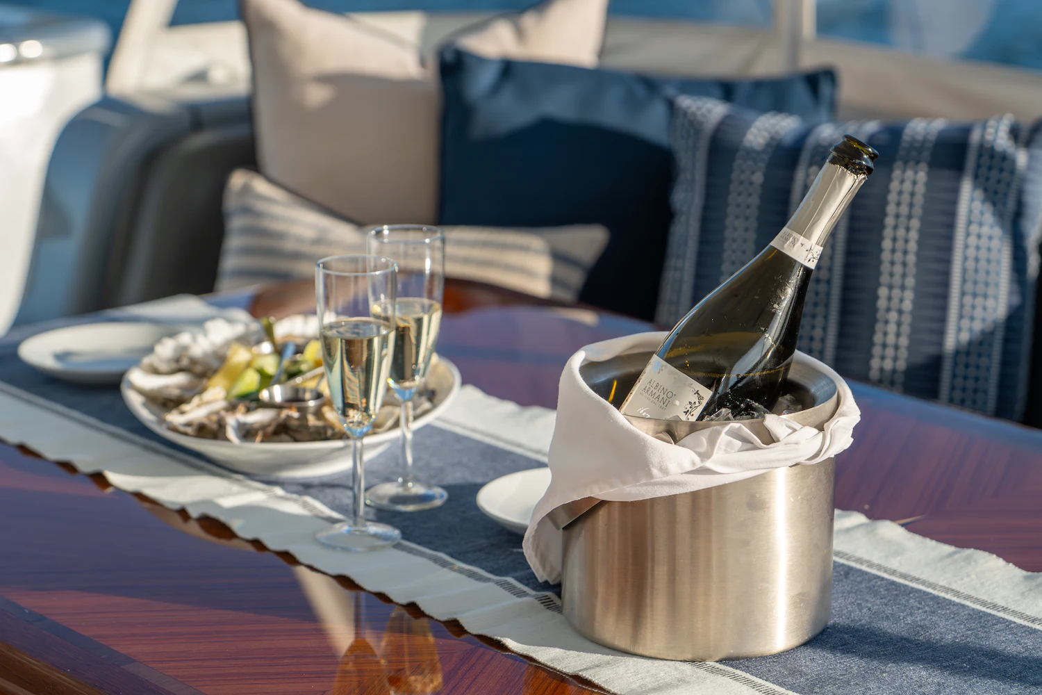 a table with food and a glass of wine aboard SURFBIRD Yacht for Charter