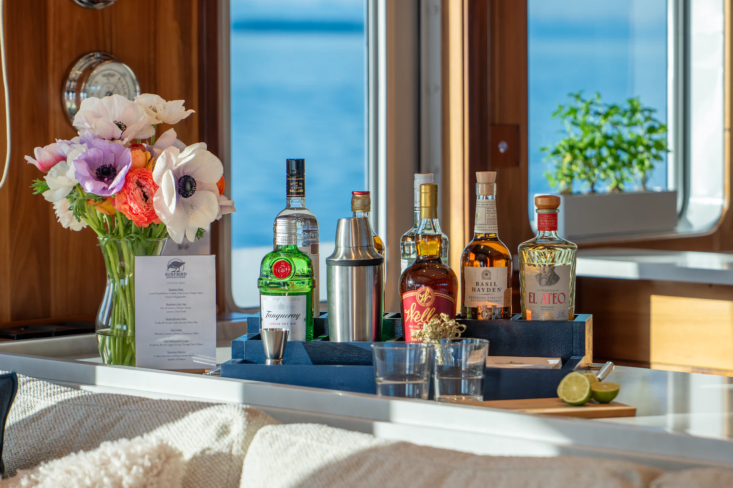 a table with bottles and glasses aboard SURFBIRD Yacht for Charter