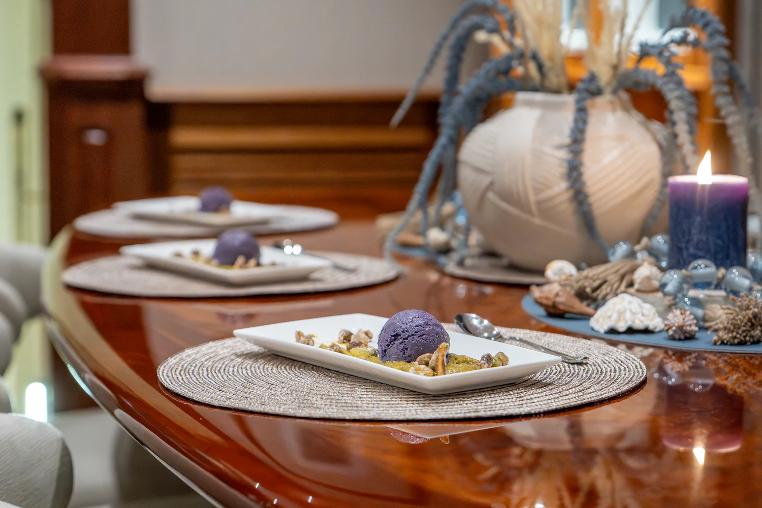a table with plates and food on it aboard SURFBIRD Yacht for Charter