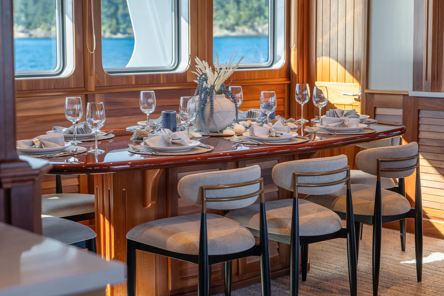 a table set for a dinner aboard SURFBIRD Yacht for Charter