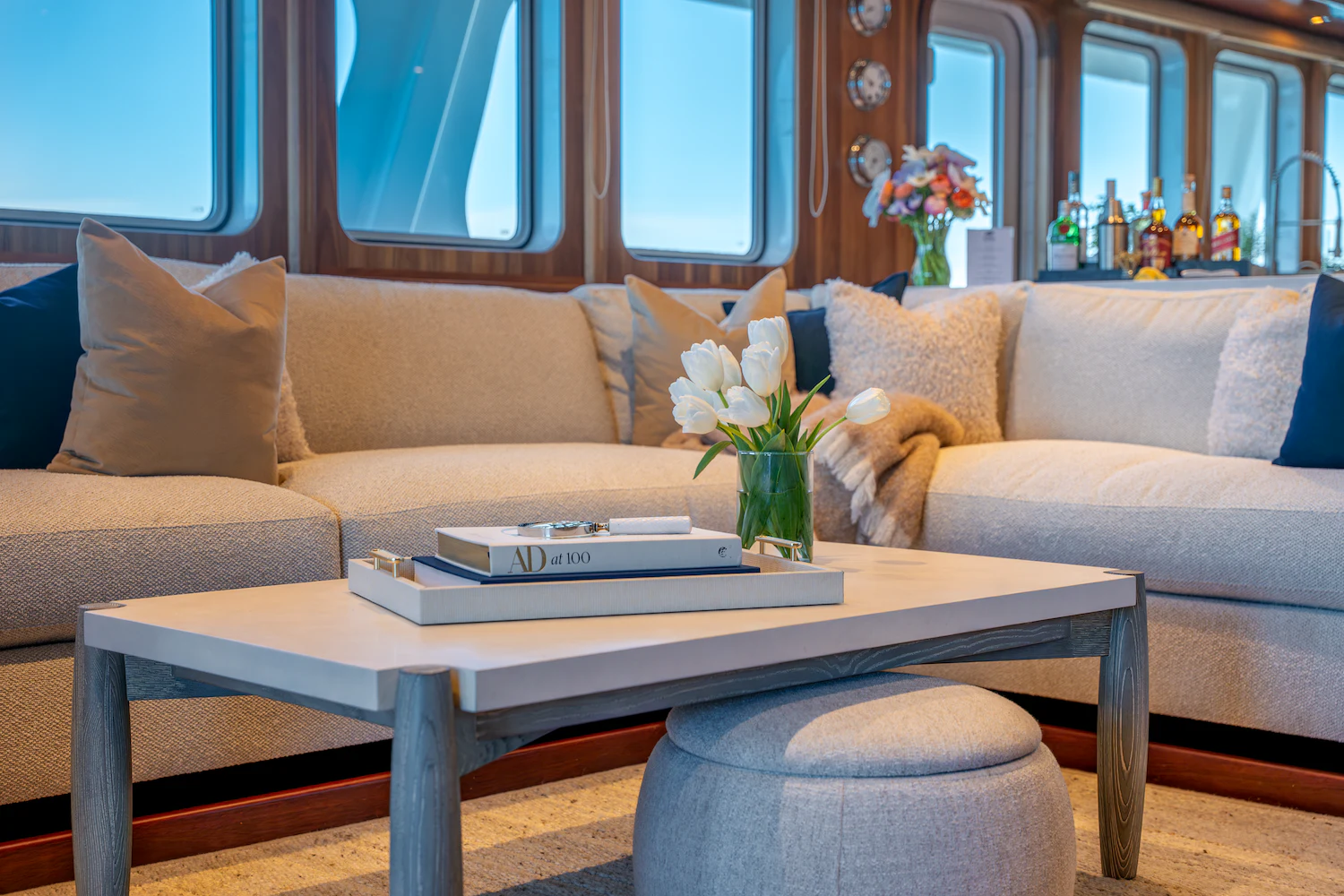 a coffee table with a book on it aboard SURFBIRD Yacht for Charter