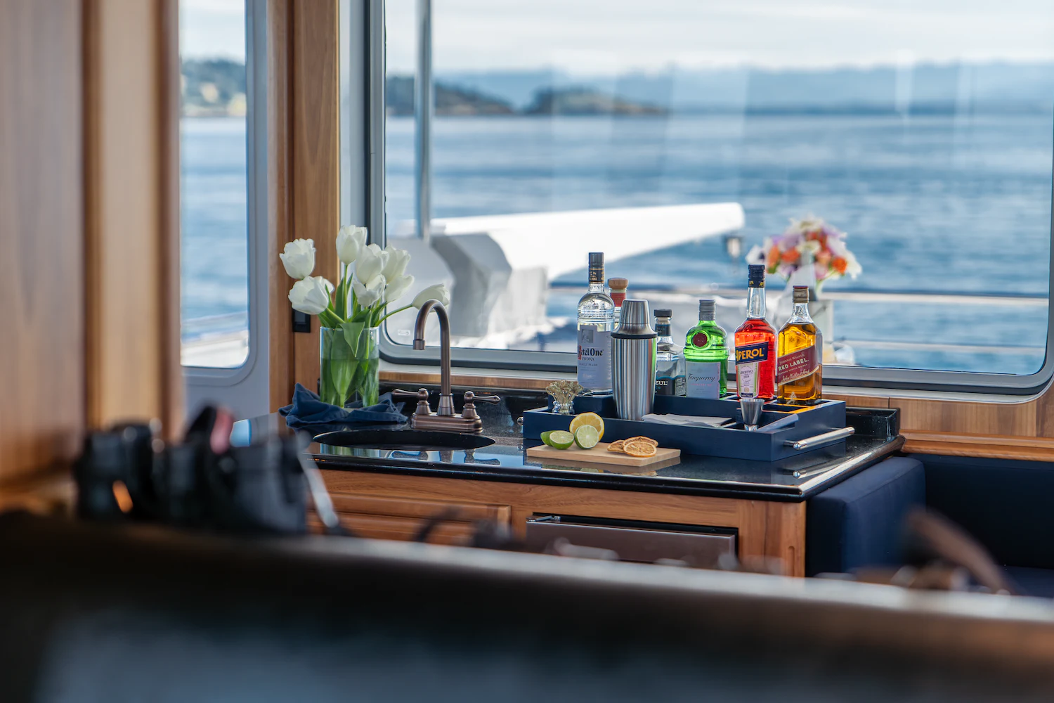 a kitchen counter with a sink and a window aboard SURFBIRD Yacht for Charter